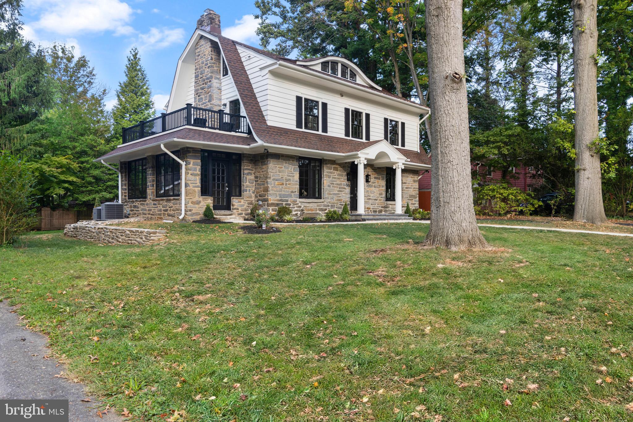 Discover the epitome of casual elegance and modern luxury in this thoughtfully and exquisitely renovated 5-bedroom, 3.5-bathroom stone colonial, situated on one of Swarthmore's most sought-after streets. This prime location is close to the Swarthmore Swim Club, Swarthmore College (with its arboretum, tennis courts, fields, lectures, and more), Downtown Swarthmore (featuring restaurants, coffee shops, retail, and the SEPTA rail line, which offers a quick 25-minute ride into Philadelphia), and even Starbucks! This stunning residence seamlessly blends classic charm with contemporary sophistication, offering a lifestyle of unparalleled comfort and style.
Upon entering, you'll be captivated by the meticulous attention to detail and the seamless integration of modern amenities with traditional craftsmanship. Every aspect of this home has been enhanced, from the all-new Marvin windows, including three walls of windows in the sun-drenched sunroom, to the bespoke design elements that highlight its unique character.
The gourmet kitchen is a chef's dream, featuring top-of-the-line appliances, including a GE Café induction stovetop with Zline hood, GE Café oven, 5-in-1 convection oven/microwave, smart refrigerator/freezer, Bosch dishwasher, filtered water faucet and filtration system, garbage disposal, sleek quartz countertops, and custom cabinetry with a "super susan" feature. The cabinets feature illuminated glass fronts and toe kick lights adding a touch of elegance. The cabinet hardware and plumbing fixtures beautifully complement the kitchen's design. Adjacent to the kitchen, just beyond the door to the backyard, a charming powder room awaits, adorned with a custom marble sink and stunning wallpaper, offering both style and convenience.
To the left of the foyer, you'll find a wonderful living room with recessed lighting and a stately fireplace with a handsome granite surround and hearth. French doors flank the fireplace, leading to the sensational sunroom with three walls of windows, another fireplace, and a separate, second entry into the home.
The primary bedroom suite is a true sanctuary, boasting its own private outdoor balcony, a spacious walk-in closet with beautiful cabinetry, a center island, a window seat, and a breathtaking en suite bathroom with tastefully appointed fixtures and exquisite tile work. Each of the additional bedrooms on this floor is thoughtfully designed with built-in organization systems, ensuring ample storage and functionality. The hall full bathroom is as stunning as the others throughout the house, featuring lovely-colored subway tile, a freestanding soaking tub with a fabulous light fixture above, a walk-in shower, and a vanity with beautiful sconces—this bathroom truly epitomizes luxury.
The third floor continues to impress with two large bedrooms, a charming and whimsical full bath, and a lovely office space. The finished basement includes vinyl flooring, a well-appointed laundry room with built-in cabinetry, shelving, a utility sink, a large storage closet, and a mechanical room with additional storage space. This home is also equipped with a state-of-the-art Sonos sound system with built-in speakers and a mini iPad for managing home functions, including climate control and music.
Step outside to the enlarged back patio, an ideal setting for relaxation or entertaining, overlooking the level yard—perfect for outdoor gatherings. The detached 2-car garage offers additional storage above, providing versatile options for your needs. Every corner of this property reflects a commitment to quality and a passion for design. Don’t miss your chance to own this exceptional home, where no expense has been spared and every detail has been thoughtfully curated for luxurious living. With its charming exterior and meticulously renovated interior, this home presents the perfect balance of classic character and modern amenities—a truly rare find in Swarthmore. More Pictures to Come!