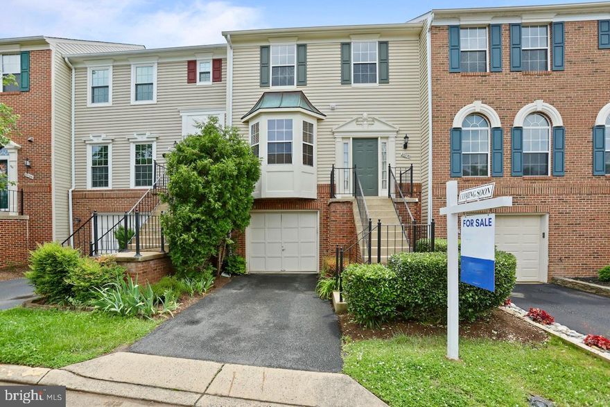 Discover this charming townhome nestled in the serene University Center neighborhood of Ashburn, VA. This home features a welcoming one-car garage and an inviting open foyer that flows seamlessly into the combined living and dining room space, creating an ideal setting for both relaxation and entertaining. The interiors are beautifully appointed with luxury vinyl plank flooring that adds a touch of elegance throughout the main level.

The heart of the home is the spacious kitchen, equipped with ceramic tile floors, abundant counter space, and a breakfast bar perfect for casual dining. The kitchen also offers room for a traditional dining table and grants access to the rear deck, making it an excellent spot for outdoor gatherings or a tranquil evening enjoying the views of the lush landscape.

On the upper level, find two primary suites, each boasting their own private, full bathrooms, providing comfort and privacy. The lower level enhances the living space with a cozy family room featuring a warm fireplace and direct access to the covered rear patio. This level also includes an additional full bathroom for convenience.

Step outside to the fully fenced rear yard, surrounded by a privacy fence and backing to picturesque trees, offering a peaceful retreat and a touch of nature.

The home's location in University Center is notable for its blend of residential comfort and accessibility. This community is close to major educational institutions, shopping centers, and entertainment options, making it a coveted address in Ashburn. Easy access to transportation links ensures that everything you need is just a short drive away, while the surrounding area offers parks, trails, and outdoor activities for all ages. This property is not just a home, but a lifestyle choice, perfect for those seeking a blend of suburban tranquility and convenient living.