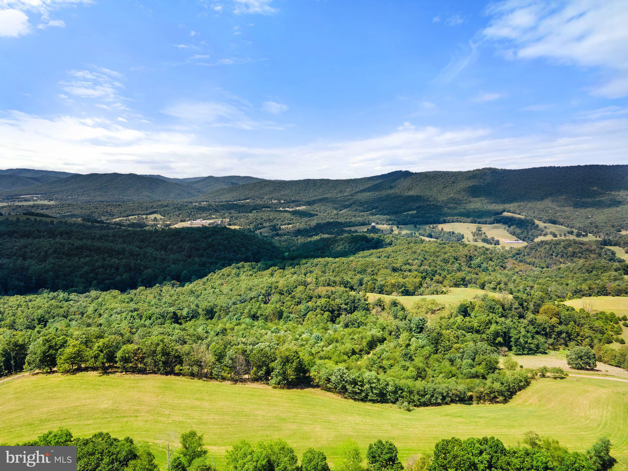 This Colonial style home is ready for your final touches. Imagine having your morning coffee on the deck overlooking the valley below. This four-bedroom three bath home has room for everyone. The chef of the house will not feel excluded from any conversations in the centrally located kitchen open to all the living areas on the main floor. Two private areas are set up to quietly allow the residents to work remotely one on the main floor and one in the owner's suite. The basement is a prime location to set up gaming tables, a movie theater, or a home gym. Everything about this home welcomes you to wild, wonderful West Virginia. Located just an hour out of Harrisonburg Virginia. The driveway is a dirt road going uphill and may periodically wash out. The property is being sold as is where is.