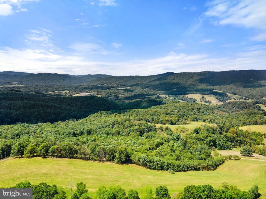 This Colonial style home is ready for your final touches.  Imagine having your morning coffee on the deck overlooking the valley below. This four-bedroom three bath home has room for everyone. The chef of the house will not feel excluded from any conversations in the centrally located kitchen open to all the living areas on the main floor. Two private areas are set up to quietly allow the residents to work remotely one on the main floor and one in the owner's suite. The basement is a prime location to set up gaming tables, a movie theater, or a home gym. Everything about this home welcomes you to wild, wonderful West Virginia. Located just an hour out of Harrisonburg Virginia. The driveway is a dirt road going uphill and may periodically wash out. The property is being sold as is where is.