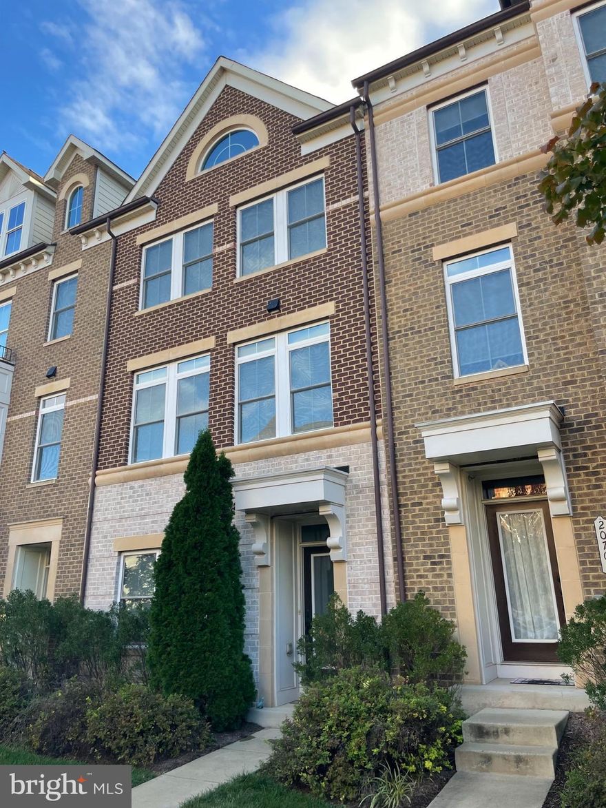 Welcome to your dream townhome nestled in the heart of a vibrant community. This exquisite 4-bedroom, 3.5-bath townhome offers an unparalleled lifestyle with its prime location within walking distance to an array of entertainment and shopping options, including ONE Loudon, Top Golf, Trader Joe's, and much more.

As you step inside this meticulously maintained home, you are greeted by the warmth of hardwood floors that adorn both the lower and main levels. Natural light streams in through large windows, creating a bright and inviting atmosphere throughout.

The gourmet kitchen is a chef's delight, featuring modern appliances, ample counter space, and a large center island. The open layout seamlessly connects the kitchen to the living and dining areas, making it perfect for both everyday living and entertaining.

Storage is never an issue in this townhome, with an abundance of closets and storage spaces thoughtfully integrated into the design. The 2-car garage boasts a convenient bumpout, providing additional room for storage, perfect for all your outdoor gear and tools.

The primary bedroom is a true retreat, offering two spacious walk-in closets, tray ceilings, and a well-appointed ensuite bathroom with a stand-up shower and a double vanity. Each of the three additional bedrooms offers comfort and space, with a flexible layout for your family's needs.

The lower/walkout level provides added versatility with a bedroom featuring elegant French doors, making it an ideal space for a bedroom, office, or play area. A full bathroom on this level adds to the convenience and functionality of the home.

Step outside to the beautiful trex deck, where you can enjoy outdoor gatherings and the lovely views. A large walk-in pantry ensures that you have ample space for your culinary needs and storage.

This townhome is in pristine condition, ready for you to move in and make it your own. With its exceptional features and prime location, it offers a lifestyle that combines luxury, convenience, and endless opportunities for entertainment and leisure.

Don't miss this incredible opportunity to own a townhome that offers it all – from the comfort of your home to the excitement of the surrounding community. Welcome to a life of convenience and luxury!