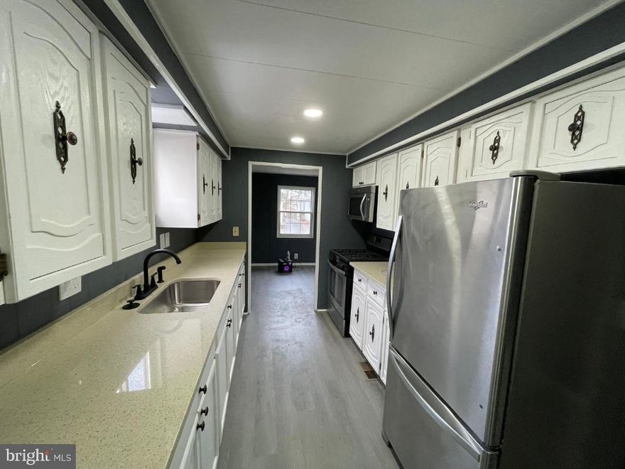 Move-In Ready Manufactured Home in Meadows of Chantilly
Remodeled manufactured home offering 2 bedrooms and 2 full bathrooms.    
Exterior features include new plywood-covered structure, two new exterior staircases, and asphalt roof siding.     
 Interior updates include new windows, doors, flooring, carpeting, water heater, plumbing, and a new electrical system with recessed lighting.
The updated kitchen features granite countertops and ample cabinetry.
 The primary bedroom includes an ensuite bath with tub and separate walk-in shower. Additional updates include new toilet and vanity.

Remodeled  and ready for immediate occupancy. 
Located in the Meadows of Chantilly community.