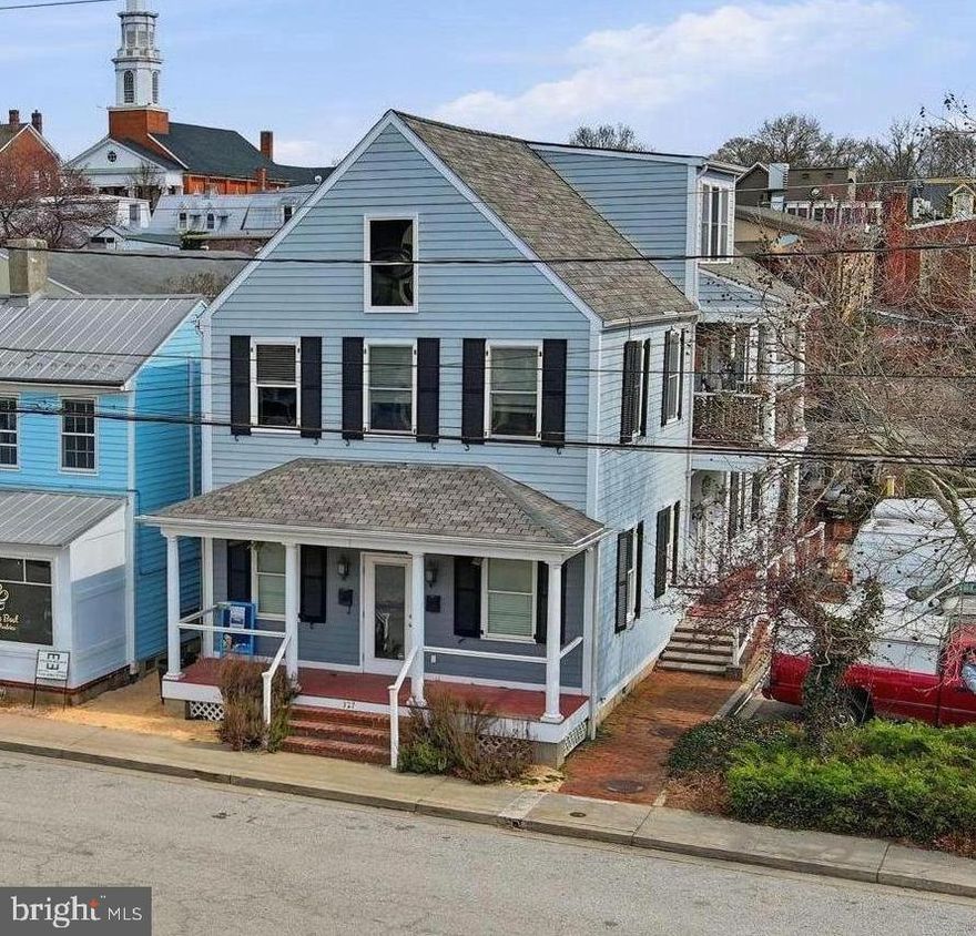 Mixed-use commercial property in charming historic Chestertown. 327 Cannon was newly constructed in 2006, yet is perfectly situated in bustling historic district. Offering historic charm without the extra maintenance. The building contains two large units with many possibilities.
The first level is outfitted with a commercial kitchen and large dining space overlooking Cannon St. Over 1300 sq ft of professional kitchen space, an office, and dining area. The space has many possibilities for a restaurant or other commercial business in the future. Currently, this unit is leased to Occasions Catering. 

The upstairs apartment is inviting and spacious, offering two bedrooms each with an ensuite full bathroom. The living space is open and airy, with ample natural light, vaulted ceilings, hardwood floors and a gas fireplace. The large loft could be an office, den, or creative studio space. The walk-in attic provides additional storage.  An ideal investment in historic Chestertown.