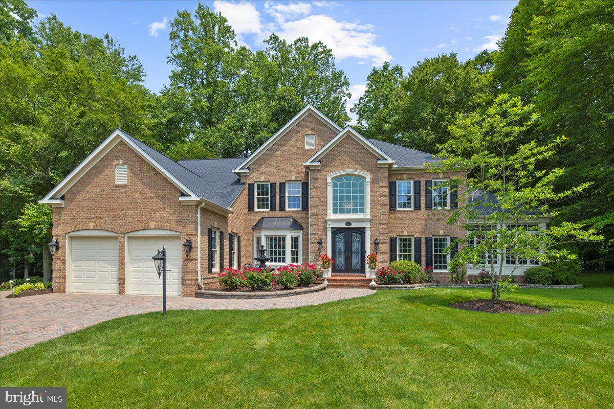 Over 8,100 sq. ft. on A Premium Lot in The Preserve at South River Colony, A Golf Course Community | Community Pool, Tennis, Pickleball, Walking Trails, Sports Courts | Refined living at an exceptional price.
Tucked away at the end of a cul-de-sac in the amenity-rich South River Colony, this beautifully composed home blends timeless architecture with modern refinement. From the moment you arrive, the solid iron entry doors and elegant stone hardscaping speak to the level of craftsmanship carried throughout the home. The lush front and side yards offer beautiful green space—ideal for play, pets, or simply soaking up the sunshine—while the private backyard is perfectly designed for entertaining, with space to gather, dine, and relax. The exceptional features and high-end touches truly stand out when experienced firsthand.
Inside, the layout unfolds with intention. Surrounded by floor-to-ceiling windows, you'll find wide-plank flooring, detailed millwork, and luminous, light-filled spaces throughout. At the heart of the home, A Chef's kitchen (2021) features a thick quartz island and premium finishes, opening seamlessly to multiple custom stone terraces framed by mature trees and natural privacy.
A stunning, custom-designed office completes the main level—bathed in natural light, appointed with tailored built-ins, and perfectly positioned to feel both connected and quietly removed from the central living areas.
The spacious primary suite is just as curated, complete with expansive windows, a serene sitting area, and a spa-inspired bath with heated floors and calming finishes.
The lower level, ideal for entertaining or extended living, not only offers a full second kitchen, wet bar, full bath, gym, multiple flex rooms, ample storage, but also features an impressive walk-in climate-controlled wine cellar—complete with a tasting area and keypad entry.
Every element, from the 2023 architectural roof to the home’s high-end finishes and mechanical upgrades, reflects enduring design and intentional investment.
Set within a vibrant golf course community offering resort-style amenities—including pools, tennis, pickleball, and basketball courts, walking trails, tot lots, and access to a private member-only golf club—this exceptional home is centrally located with convenient access to Annapolis, Washington, D.C., and Baltimore.