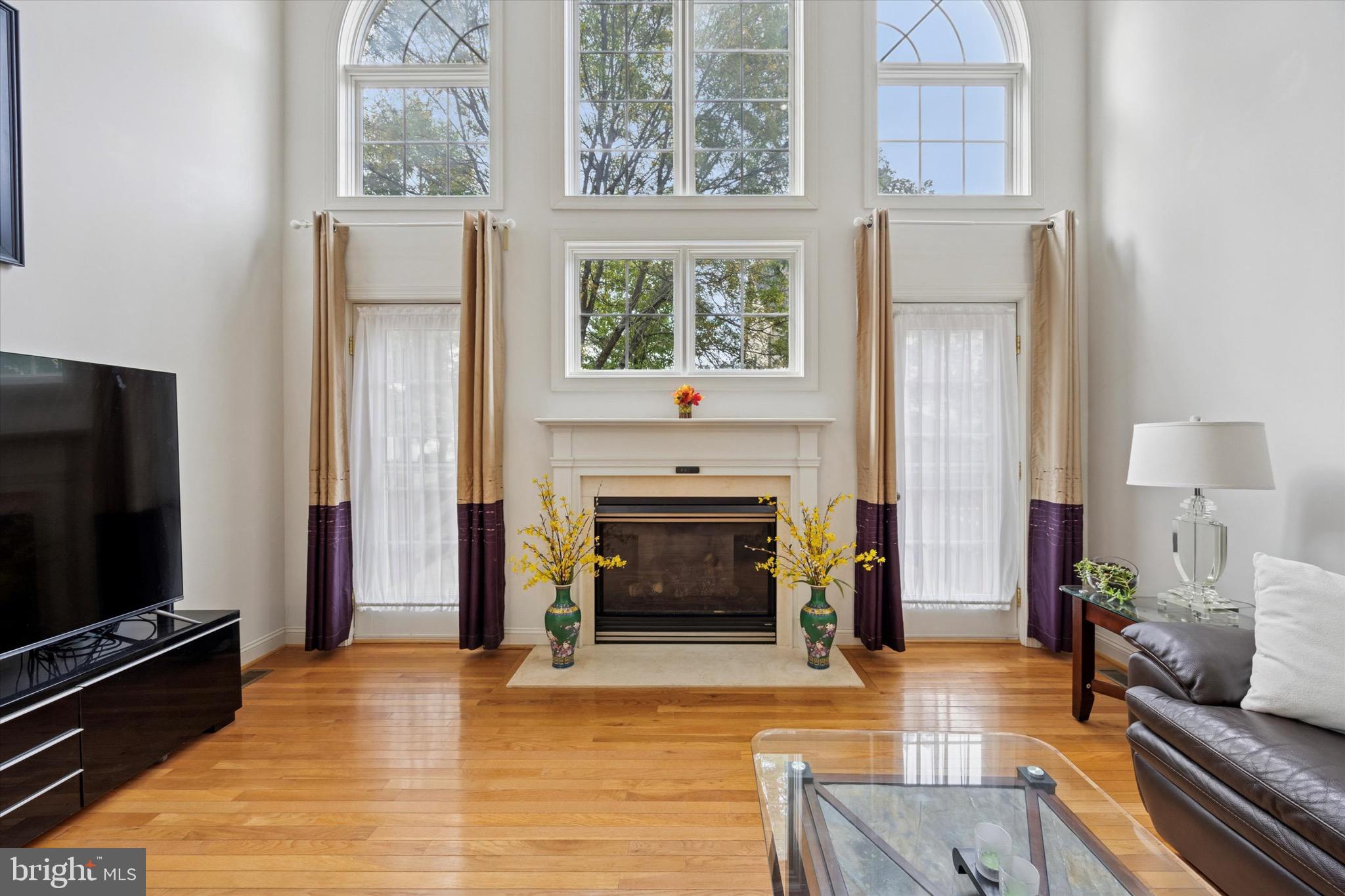 Welcome to 1255 Johnson Lane, an impeccably maintained end-unit carriage home in the highly desirable Villages of Trewellyn. This sun-filled residence offers the perfect combination of comfort, style, and convenience, all within the award-winning Wissahickon School District. Step inside to a dramatic two-story foyer with gleaming hardwood floors, soaring 9-foot ceilings, and upgraded 8-foot doors throughout, creating an open and airy feel. Oversized south-facing windows bathe the main living spaces in natural light all day long, while recessed lighting in nearly every room enhances the modern design. The spacious living and dining areas feature a cozy gas fireplace and access to a private Trex deck overlooking open green space—ideal for relaxing or entertaining. The open-concept kitchen is a chef’s delight with stainless steel appliances, ample cabinetry, and a large center island that comfortably seats two. An extended overhang counter provides space for three to four additional seats, making it perfect for casual dining or gathering with friends and family. Thoughtful upgrades include new hardwood flooring in the living and family rooms, updated light fixtures, and a tiled breakfast nook with a built-in seating area. Upstairs, the oversized primary suite is a retreat with vaulted ceilings, two walk-in closets, and a versatile bonus room perfect for a home office or gym. The spa-like ensuite bath includes a soaking tub, stall shower, and dual vanity. Two additional bedrooms share a refreshed full bath, each offering generous closet space. The finished basement expands the living area with a fireplace, dimmable recessed lighting, and flexible space for a media room, playroom, or additional bedroom with a full bath already framed and roughed in. Additional enhancements include a waterproof laminate plank floor on the second level, a built-in humidifier with the heating system, and newer HVAC components for peace of mind. Outdoor features include newer screen doors, and low-maintenance perennial gardens supported by built-in lawn and fire sprinkler systems. With extra parking on a quiet side road, a south-facing yard, and scenic community walking trails, this home offers exceptional value. Perfectly situated just minutes from Route 309, the PA Turnpike, Whole Foods, Trader Joe’s, and The Shoppes at English Village, this home truly has it all—modern upgrades, thoughtful details, and an unbeatable location. Don’t miss your chance to make this exceptional property your new home. Schedule your private tour today!