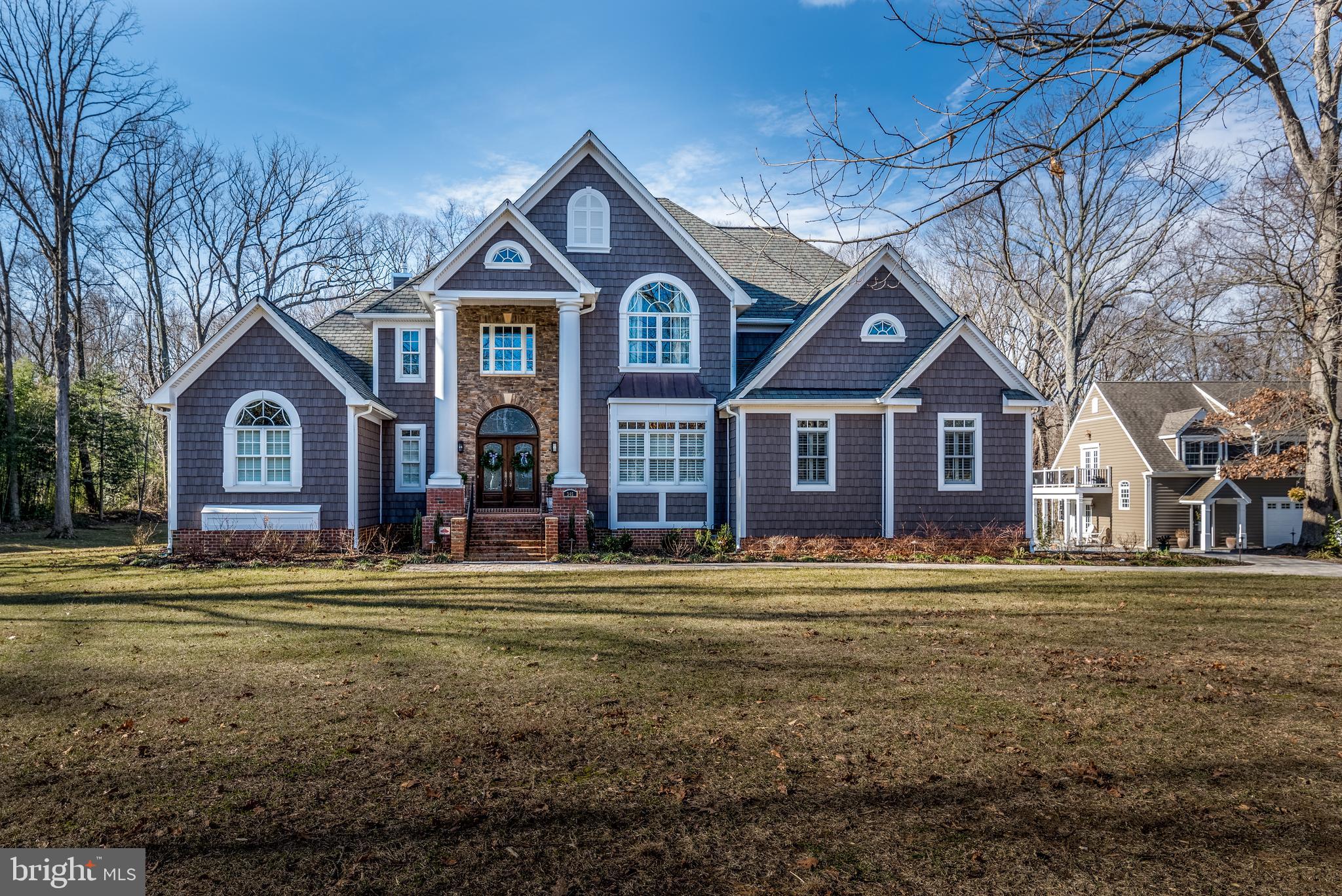 This Annapolis retreat situated in a wonderful neighborhood, within minutes of Historic Annapolis, the Village of West Annapolis, the Navy Stadium & Academy, shopping, the Severn River and more. Fantastic convenience and yet, one of the largest available estate lots in the area for privacy. Over 10,000 square feet of finished space between the main home and the guest house. The lower level was also designed as a fully functioning residence for visiting family members. Income potential with the guest house or perfect for aging parents, college kids, or a nanny. Backyard has plans drawn for a pool and pool house. Text or email Listing Agent Tim to schedule a showing.