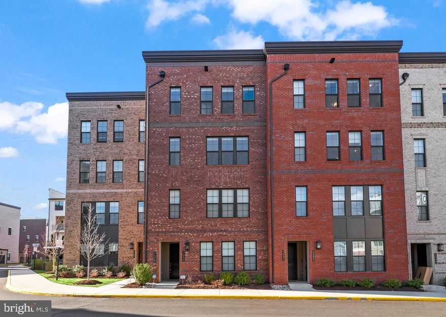 Location, Convenience, Turn Key, and an Amazing View! Your new home awaits you at Union Park at McLean. This four-story townhome has everything you want and more!
Saunter up to the second level to the spacious open layout where your culinary haven is set in between the living/family room  and the dining area; a perfect atmosphere for entertaining and hosting family and friends. Your haute cuisine kitchen showcases a large walk-in pantry, upgraded white cabinetry, quartz countertops and backsplash, an expansive island, stainless steel Whirlpool French door refrigerator, microwave, wall oven, vent hood, and a new Bosch stainless steel dishwasher. Elegant wood flooring extends throughout the main level, staircase, and upper hallway, adding warmth and sophistication.
The third level is where you’ll find your luxurious primary suite with a large walk-in closet and a spa-like en-suite bath complete with a glass-enclosed shower with seating, dual-sink vanity, private water closet, and an electric towel warmer. The two secondary bedrooms share a well-appointed full hall bath with a dual-sink vanity and combination tub/shower set up. For added convenience, the laundry room is also located in this level and has your front-loading washer and dryer with an attached wood tabletop and provides additional storage.
The last but not the least fourth level offers an incredible rooftop view, making it the perfect spot to enjoy cocktails, summer nights, watch fireworks, or simply stargaze!
This home is packed with premium upgrades, including Toto bidets with remotes in all three bathrooms and five ceiling fans with remotes. Additional enhancements include a new quiet garage door system, ADT security panels and monitoring, and Ring camera doorbell (inside and outside the garage, and on the rooftop). Military grade Haven lockdown door locks have been installed on the front, garage, and rooftop entry doors for added peace of mind. The garage floor features a durable epoxy finish, and electric outlets have been installed in all four large closets for extra convenience. Custom window treatments, including curtains, shades, and blackout shades, complete the home's refined aesthetic.
The sellers are also including various furniture pieces at no additional cost. Please refer to the list of conveyances for details.