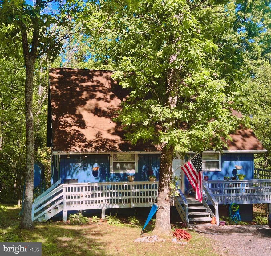 This cozy 3-bed 2 bath A-frame with 3 acres is an investors dream!  A vacation home, Airbnb, or even a place to call home.  The possibilities are endless! 10 minutes from BRYCE Resort and over a dozen Wineries and Breweries within 45-mile radius.  Enjoy the seasons relaxing on the wrap around deck.  Don't miss out on this opportunity! Property being sold as is.