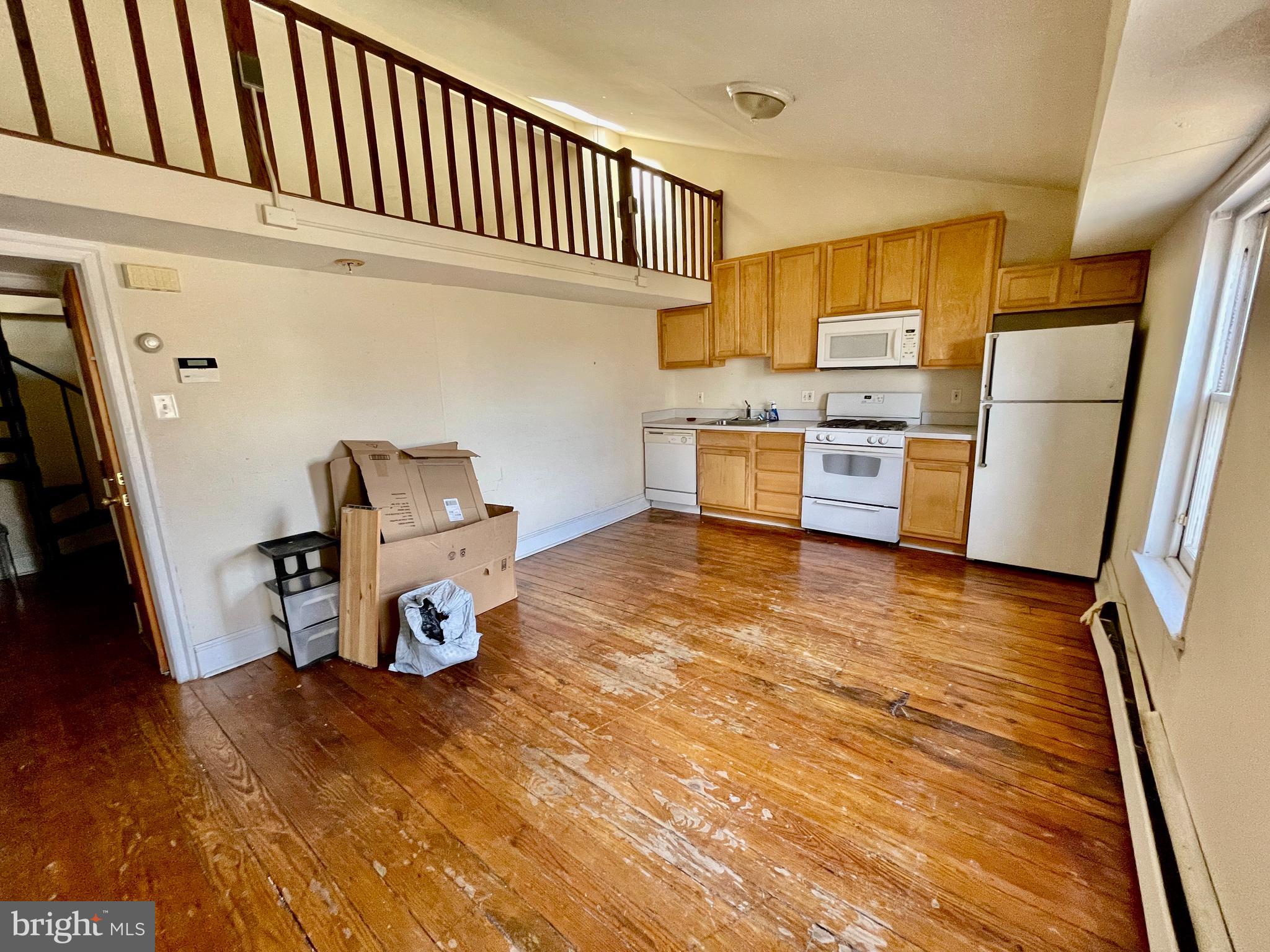 Large, bi-level one bedroom East Falls apartment available for early July occupancy. Hardwood floors have recently been refinished. The open living/dining/kitchen area has a high ceiling that extends over the second floor loft area which is accessed via a spiral staircase. The kitchen is outfitted with ample cabinet space and a full suite of appliances including dishwasher and gas range. The bathroom has a tiled floor and claw foot tub. The spacious bedroom accommodates large furniture and has an extra large closet. Cat friendly with no added fees. Tenants pay gas and electric. First, last and one month security due at lease signing. Good credit required. Reach out for showings, applications and the video tour.
