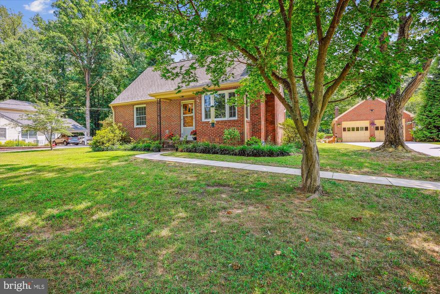 Welcome to your peaceful oasis at 1005 Orchard Way. An all-brick Cape Cod model sited on a generous 0.86 acres. Being right off of New Hampshire Ave, this property is ready for relaxation while being convenient to work, shopping and entertainment. The property has a large active fenced-in vegetable garden with everything from tomatoes, peppers, cucumbers and gourds to watermelon and a grape arbor. Inside the home, the features keep coming!  The hardwood floors have been wonderfully restored, a generous dining room, living room and 2 main level bedrooms with their own completely remodeled bathroom. You’ll find a completely remodeled and updated kitchen with a walk-in pantry. Off the kitchen is a large, screened-in back porch. Upstairs, you’ll discover a remodeled and re-imagined master suite with a new bathroom, walk-in closet and sitting area. Other updates include architectural shingle roofing, recently replaced concrete driveway and sidewalks to the front, back and garage, buried electric fence for pets, newer windows, upgraded electrical system, radon remediation system and a new boiler!  Outside there are two garden sheds for ample storage. One of the sheds has potential water/waste connection for bathroom (as is, buyer to verify). Additionally, the large brick 2-car garage has plenty of space for your vehicles while also having a large storage space above, a workshop in the back and an additional working half bath! This one is a must see and will go quickly! Property is in great condition but will be sold strictly As-Is.