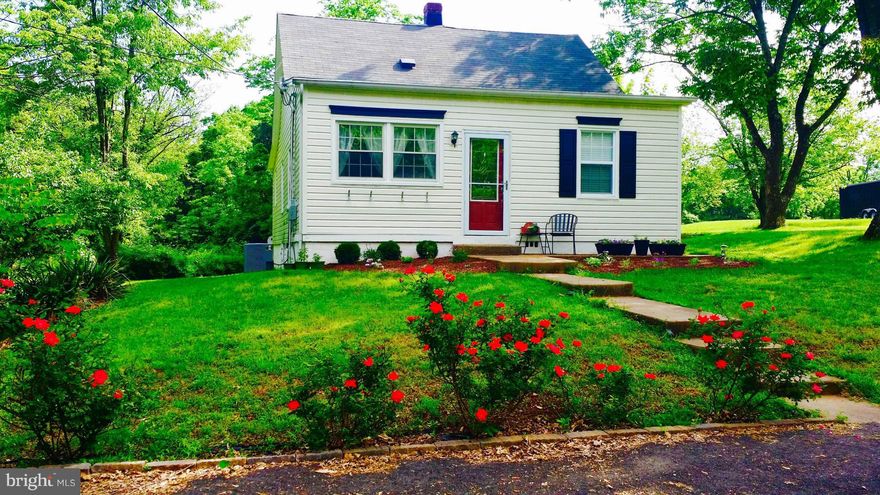 Sweet Home that has been upgraded.  Larger than it looks. Quiet setting w/the joy of nature all around.  Original nice hardwood floors. Lots of charm and character to enjoy. Granite, stainless steal & updated kitchen. Private back patio and fire pit.Use Potomac Title Group for settlement & receive free home warranty.  A rare find for single family home in a private setting at townhouse price.