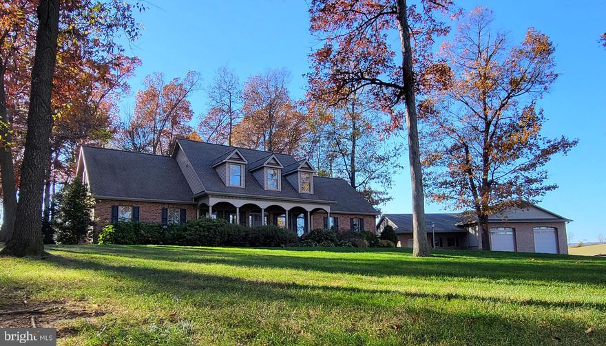 Welcome Home to 1143 Skelly Road!  This stunning 3-bedroom, 3-bathroom Cape Cod home features 3,000 SF of custom craftsmanship and timeless elegance. Meticulously maintained, this home offers a traditional layout with high-end finishes and thoughtful details throughout. 

Additionally, the hobby garage boosts nearly 4,000 SF with 16FT ceilings, (2) 14FT overhead doors, the ultimate shop and storage. Set on 4 acres in the rolling farmland of Chambersburg, privacy and comfort are the pillars welcoming you home.

Visit the TOURS for the full video.  For pre-qualified clients, schedule your personal preview today! 

INTERIOR FEATURES 
- Grand Living Room and custom cabinetry throughout 
- Soaring 17-foot ceilings, abundant natural light, and a propane fireplace create a warm and inviting space
- Expertly crafted woodwork enhances the kitchen, bathrooms, and built-ins
- Gourmet Kitchen with custom cabinetry, premium appliances & spacious countertops make this a chefs dream 
- Hardwood floors-  beautiful, well-maintained flooring throughout the main living areas
- Primary Suite retreat features a walk-in closet and a spa-like bathroom with heated floors
- Energy-efficient comfort equipped with thermal heating and air conditioning for year-round efficiency
- 400 amp electrical service - ample power to support modern living and workshop needs

HOBBY GARAGE 
- Two (2) large bays with 16-foot ceilings and 14-foot overhead doors - perfect for RVs, boats, or large vehicles
- Heated floors throughout for ideal for year-round use
- Extensive storage space - Plenty of room for tools, equipment, or even a private showroom

EXTERIORS & LOCATION
- Landscaped 4-acre lot with privacy and room to roam  
- Meticulously maintained grounds with mature trees and lush greenery create a personal oasis 
- Outdoor living spaces are perfect for entertaining, relaxing or enjoy nature 
- Situated among rolling farmland, this property is private but also conveniently located 
- Just minutes from conveniences, amenities and shopping