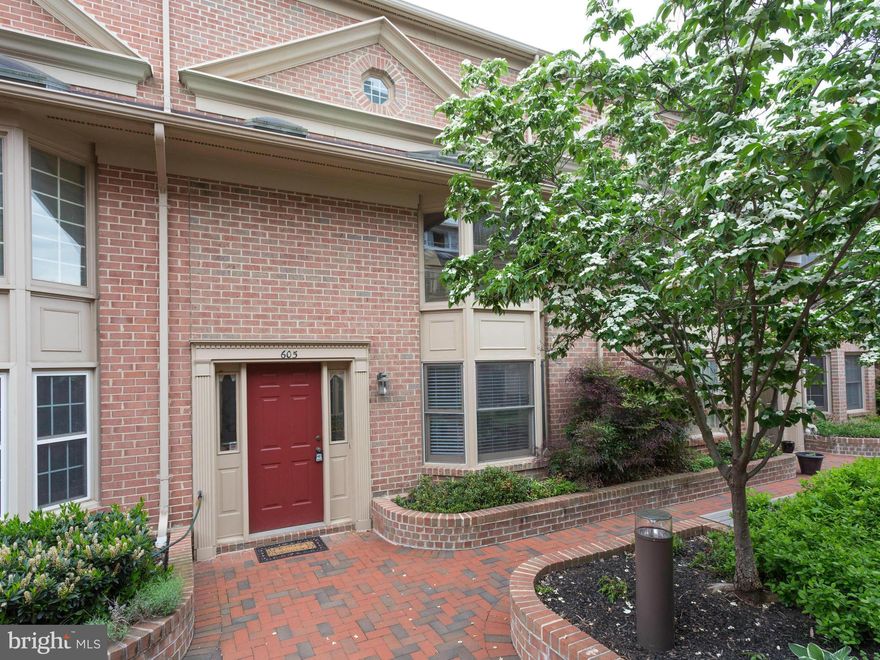 Spacious living on 4 lvls! Vaulted ceilings, loft/office overlooks kitchen! Screened deck off elegant Liv. room. Eat-in kit w/SS appliances! BR level laundry! 3rd BR (or rec room) on LL w/fireplace, 1/2BA & brick enclosed patio. MBR suite w/updated BA, walk-in closet & solarium w/skylights! Freshly painted, beautifully maintained!  BALLSTON! Garage parking! Rock Bottom & metro across street! A 10+