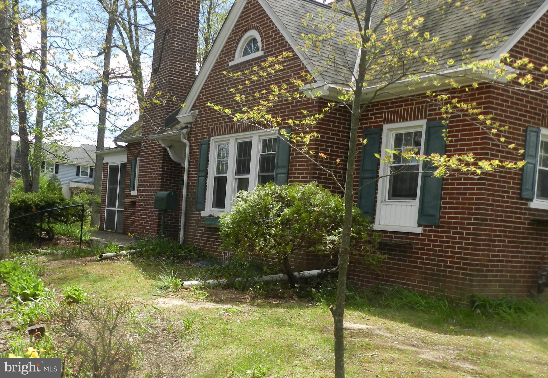 This charming brick single home is set in a woodland setting, with quint architecture. The home sits on a corner lot within walking distance of two schools, the YMCA, and a shopping center. You have four bedrooms, one bathroom, a bonus room, and a wood burning fireplace in the living room, Built-in shelving in the dining room and a laundry on the main floor. There is an enclosed from porch and hardwood flooring under all carpeted areas. You also have a full basement.
