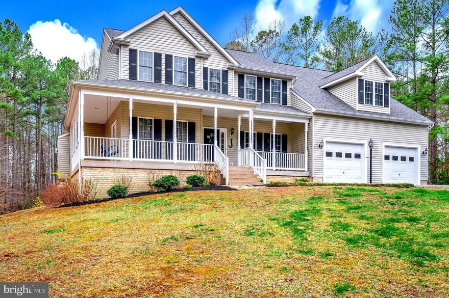 Welcome to this exquisite Colonial-style residence, a true gem nestled on a sprawling 5.31-acre lot. Built in 2000, this detached home boasts a generous total finished area of 5,592 square feet, providing ample space for both relaxation and entertainment. The property is in very good condition, showcasing a harmonious blend of classic architectural elements and modern conveniences. As you step inside, you are greeted by a warm and inviting atmosphere, accentuated by elegant features such as crown moldings and chair railings. The interior is adorned with a variety of flooring options, including plush carpeting, sleek ceramic tile, and rich hardwood, ensuring both comfort and style throughout the home. The thoughtfully designed layout includes six spacious bedrooms and four and a half bathrooms, catering to the needs of any household. The heart of the home is the expansive kitchen, which features a breakfast area and ample table space, perfect for casual dining. Equipped with high-quality appliances, including a built-in microwave, electric oven/range, dishwasher, and refrigerator, this kitchen is a culinary enthusiast's dream. A pantry provides additional storage, ensuring that all your cooking essentials are within easy reach. The adjoining family room, complete with a cozy fireplace, creates an ideal setting for gatherings and relaxation. Retreat to the luxurious primary suite, which includes a walk-in closet and a well-appointed primary bath featuring a soaking tub, walk-in shower, and dual vanities. Each bathroom in the home is designed with comfort in mind, offering modern fixtures and thoughtful layouts. Outdoor living is equally impressive, with multiple decks and porches that invite you to enjoy the serene surroundings. The attached front-entry garage accommodates two vehicles, providing convenience and security. This property is not just a home; it is a lifestyle. With its expansive lot, elegant interiors, and modern amenities, it offers a unique opportunity for those seeking a tranquil yet sophisticated living experience. Don’t miss the chance to make this remarkable residence your own. Schedule a viewing today and discover the perfect blend of comfort, style, and functionality that awaits you. NEW ROOF IN 2024, FIRST AND 2ND FLOOR PRIMARY SUITES, SPA SHOWER in Lower Level,HVAC UPDATED,  NEWER CARPET & PAINT., ELECTRIC Car PLUG in GARAGE, CONVENIENT TO SHOPPING, LAKE ANNA, AND SCHOOLS