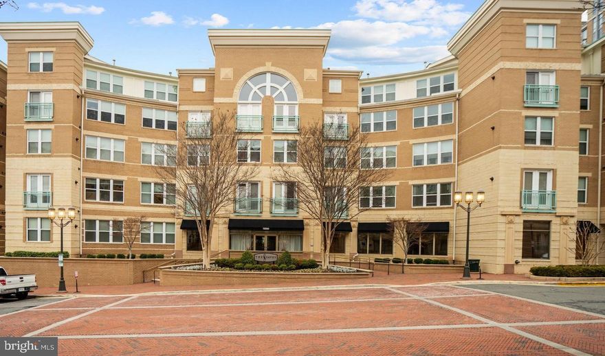 Welcome to 12000 Market St #139, a beautifully updated 2-bedroom, 2-bathroom condo in the highly sought-after building “The Savoy” at Reston Town Center. The open floor plan is filled with natural light and offers a unique layout with angled rooms, wholly separated bedrooms with en-suite bathrooms, AND an ultra-rare private patio. Unlike other units with balconies accessible from the courtyard, this patio is fully enclosed with no public access, providing a true sense of privacy. The open and spacious kitchen features stainless steel appliances, a gas range, a stylish backsplash, and a generous pantry. The living, dining areas, and bedrooms boast LVP flooring, recessed lighting, and an inviting ambiance that flows seamlessly throughout the home. The primary suite includes an ELFA walk-in closet system and an updated en-suite bath with walk-in shower. Additional highlights include marble flooring in the kitchen and bathrooms, modern ceiling fans, updated blinds in all rooms, and a laundry room for added convenience. This floor plan provides lots of room/furniture configurations - for example, the dining room could also be used as a home office. The unit is ideally positioned within the building, located just steps from the elevator and trash room. It offers easy access to the pool and courtyard while maintaining complete patio privacy. The gym and the St. Francis Street exit are just down the hall, making everyday living incredibly convenient. The condo has TWO assigned garage parking spaces, one directly outside the elevator, and it is within walking distance of the RTC Metro Station. The Savoy at Reston Town Center offers resort-style amenities, including a large, fully equipped fitness center, a lounge, a clubroom with a pool table and card tables, a movie screening room, a bike storage area, and a spacious courtyard with grilling stations. The building also features a resort-style pool with all-day sunlight and a front desk concierge for added convenience. This turn-key home is perfect for professionals, roommates, or families seeking a stylish and private living space in the heart of Reston Town Center. Experience the ultimate in convenience and modern living—schedule your showing today!