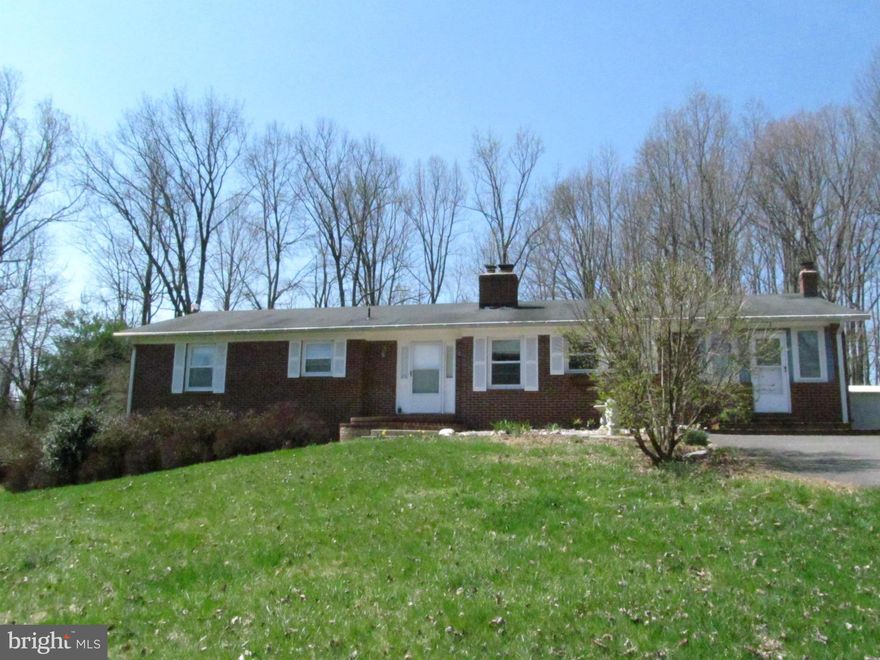 Reduced! Private location on 5 acres convenient to Rt 29.  New heat pump, refrigerator, dishwasher, paint.  Nice deck for entertaining, fenced yard for pets, 2 sheds. paved driveway.  Family room with wood burning fireplace, formal dining room, sun filled kitchen, sun room/office off kitchen, large laundry room, 3 BR's on main level. Basement is finished w/ BR, bar, bath and workshop! NO HOA!
