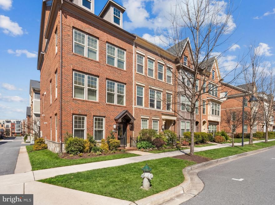 Experience the pinnacle of luxury living in this stunning 4-level brick and stone end-unit townhome, nestled in an idyllic location within the community. Mere 2 blocks from the convenience of Downtown Crown, yet on a peaceful and quiet centrally located street. Over $55,000 of recent upgrades. This beautiful home features recent elegant upgrades that flow seamlessly throughout with 4 spacious bedrooms, and 3.5 baths. Recent Upgrades include, top to bottom freshly painted interior, newly lightened kitchen cabinets, new lighting and hardware , new carpet throughout, new dual vanity in the primary bath,  a new HVAC system, and a fully extended deck with premium Trex. The open-concept layout seamlessly connects the gourmet chef’s kitchen to the living and dining areas, perfect for hosting gatherings. . The top level is versatile  Flex room; ideal for a media room , an office, or an extremely private and spacious 4th bedroom and is accompanied by a lovely rooftop terrace with a dual sided fireplace adding  beautiful ambiance to both the indoor and outdoor areas. This meticulously maintained home offers ample parking with a 2-car garage and a driveway pad for two additional cars. Located just steps from Crown’s vibrant restaurants, shops, gyms, and spas, as well as "The Retreat"—a private community clubhouse with a pool and tennis courts—this home combines elegance, convenience, and modern amenities in an unbeatable location close to Rio, The Kentlands, I-270, ICC, and the Metro. As well as, '"new dedicated bus lanes that are a part of the Great Seneca Transit Network (GSTN), which will provide frequent transit options, improving mobility and access to crucial jobs in the healthcare, biotech, and education sectors.