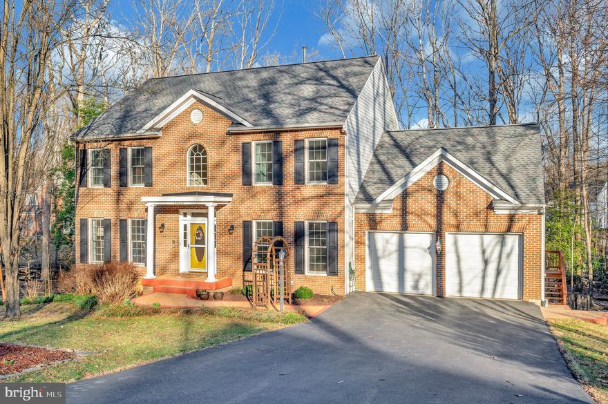 Immaculate Brick Front Home on a Private 1-Acre Wooded Lot

Nestled in a serene, private setting, this immaculate traditional brick front home offers the perfect blend of elegance, space, and modern updates. Situated on a picturesque 1-acre wooded lot, this stunning residence boasts 5 bedrooms, 3.5 baths, and an array of thoughtful features designed for comfort and convenience.  

Upon entering, you’ll be welcomed by freshly painted walls and beautifully refinished hardwood floors throughout the main level. The home features formal living and dining rooms, a private main-floor office, and a cozy family room with a wood-burning fireplace—perfect for relaxing evenings. Large windows throughout flood the home with natural light, enhancing its warm and inviting ambiance.  

The spacious kitchen offers ample cabinet and counter space, seamlessly connecting to the dining and living areas. Enjoy your morning coffee in this charming, light-filled breakfast nook, featuring elegant Palladian windows that bathe the space in natural sunlight.  Upstairs, you’ll find four generously sized bedrooms, including a spacious primary suite with with a vaulted ceiling and a remodeled en-suite bath (completed in 2021).  Relax and unwind in the luxurious standalone clawfoot tub, perfectly positioned in the primary suite with expansive windows that offer a serene view of the private, wooded backyard.

The fully finished basement provides incredible versatility, featuring a second full kitchen, an additional living area, a fifth bedroom, a flex room, and a full bath—ideal for guests, in-laws, or rental potential.  The basement also has its own private entrance/exit leading directly to the large lower decks, creating a seamless indoor-outdoor living experience.

Outdoor Oasis! Step outside to enjoy the expansive upper and lower decks, freshly painted and perfect for entertaining or relaxing while taking in the peaceful wooded surroundings. The large, fully fenced backyard features a tranquil creek, adding to the home’s natural charm. As an added bonus, the current owners are leaving behind a generous supply of firewood for the new owners to enjoy.  

Recent major updates include a new roof, HVAC system, all new windows on the second floor, new driveway, and sewer pump, ensuring peace of mind for years to come.  You'll find fresh paint throughout, gleaming refinished hardwood floors, newer appliances, and many more updates!

Prime Location! Conveniently situated near shopping, dining, top-rated schools, and with an easy commute to Washington, D.C., this home offers the best of both privacy and accessibility.  

Don’t miss this rare opportunity to own a beautifully maintained home in a highly sought-after location—schedule your showing today!