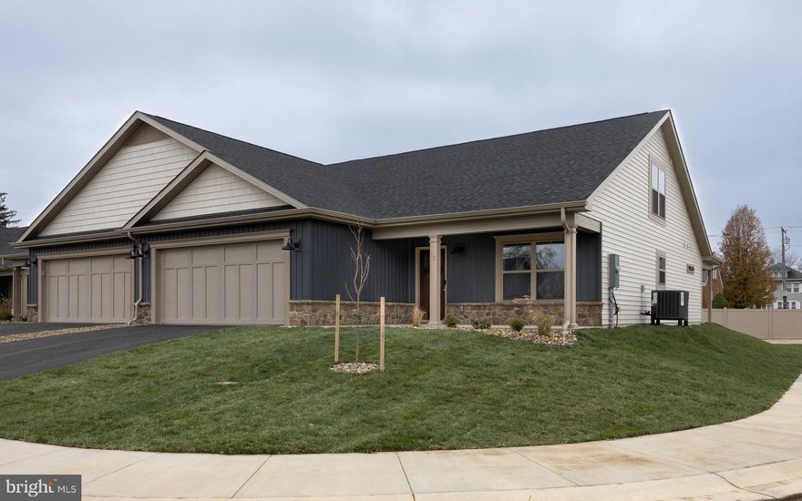 CORNER LOT!!! THE LAST 3 BEDROOM VILLA IN THIS NEW 55+ COMMUNITY!  Construction of this home is COMPLETE and the pictures on this listing are of the actual home as it is.  QUICK MOVE IN!  Choose from 2 of these 4 builder incentives: free washer & dryer set from Spicher's up to a $2,500 value, $4,000 towards closing costs, $2,000 credit for new blinds from Budget Blinds of Martinsburg OR the first year of HOA dues paid!!  Mowing of your lawn, curbside trash pickup, road maintenance and snow removal of your driveway, sidewalks and the roads are all included as part of your HOA dues!  

Welcome to The Villas at Warm Springs - Berkeley County's newest 55+ Community.  This NEW LOW MAINTENANCE community is made up of only 14 Villa homes and offers a peaceful setting with sidewalks throughout.  It is conveniently located close to shopping, restaurants, medical facilities and has easy interstate access.  All villas come standard with a beautiful ceramic tile zero barrier Owner’s Shower, matte black lever door handles and fixtures, architectural grab bars in the Owner’s Suite bathroom and quartz or granite countertops throughout the kitchen and bathrooms.  Enjoy the ease of mobility with 36" doorways, no step thresholds and LVP throughout the main level.  A large laundry room with a sink is located immediately outside of the Owners Suite bedroom. Huge Bonus Room is upstairs - perfect for guests, hobbies or storage! These features provide low maintenance living so you can enjoy accessibility throughout your new home.  The yard has been finished with lush sod, river rock landscaping and low maintenance shrubs.   TOUR TODAY!