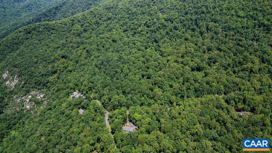 As one of the largest lots in Stoney Creek at 9.226 acres, this piece of land is a true nature lovers dream. There are impressive boulders and old growth forest throughout. This double mountain lot is at the very top of Stoney Creek at around 2100?, and is complete with opportunity for year-round mountain views or seasonal views towards Devils Knob Mountain, Blackrock Mountain, and the Rockfish Valley. There are already two ramps built in for access options, complete with culverts. About 3/4 of the way up the lot is a plateau which makes for an easier site to build a large home with a garage and ample parking. The Far Knob neighborhood is now made up of several large estate properties with impressive, well-sited homes. This area lends itself to great privacy and those wanting to achieve a mountain feel yet still have quick access to the valley community. Bring your hiking shoes to walk this impressive lot! It backs up to Crawfords Knob Nature Preserve, making the explorations and adventures endless. Also for sale is the adjacent lot (#52) at 7.353 acres.