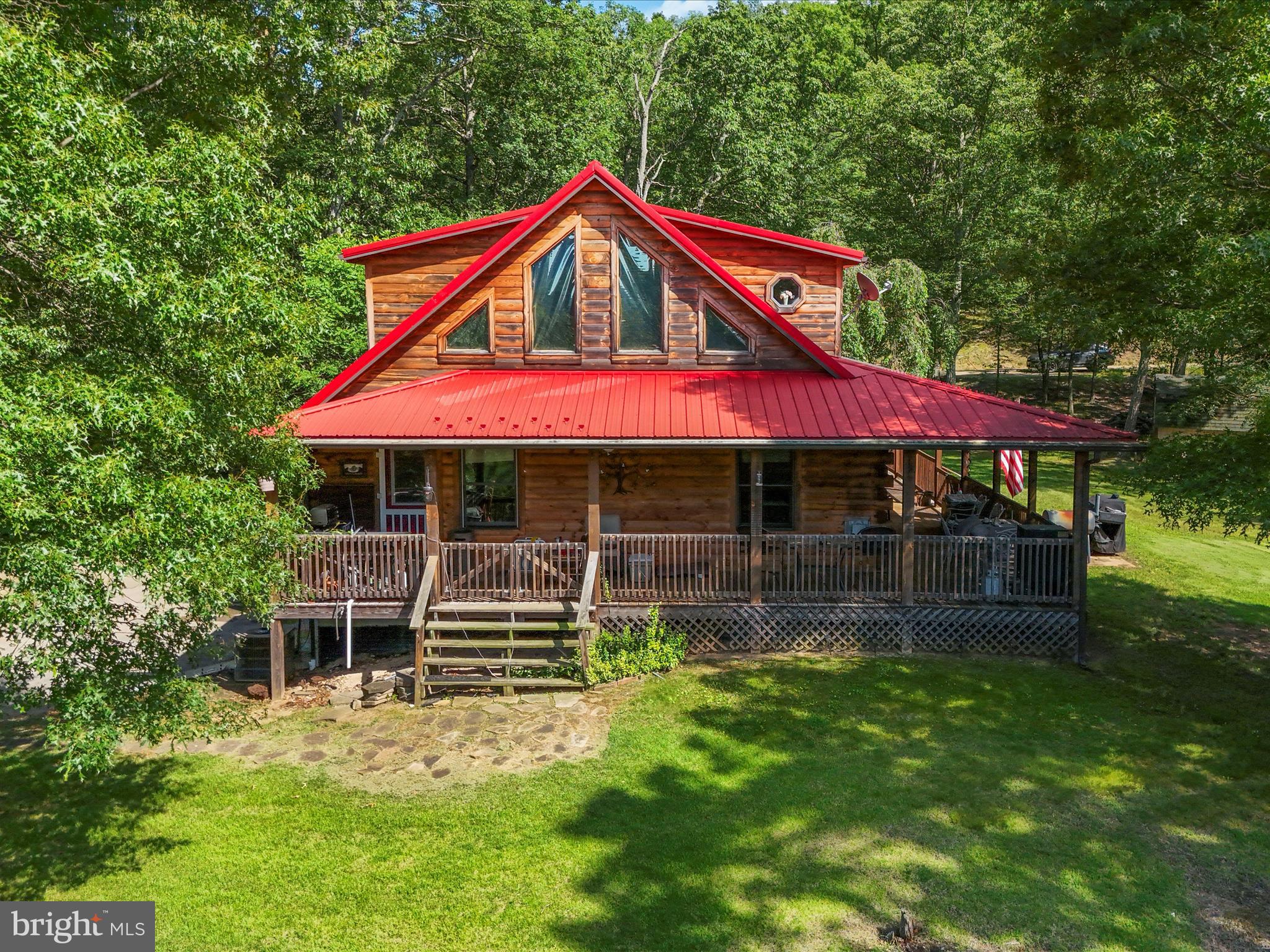 Get ready to do your best Daniel Boone impersonation and run for the WV hills! This wonderful cabin in the woods rests on 20 acres of Wild and Wonderful WV woodside! If privacy and seclusion are what you want, you need not look any further. Imagine yourself sitting around the campfire in the summer with only the sound of chirping crickets in the background. Or bundled up on a snowy winter's evening, watching the snow mount on the boughs of trees in silence. This is why they call it "Almost Heaven, WV".