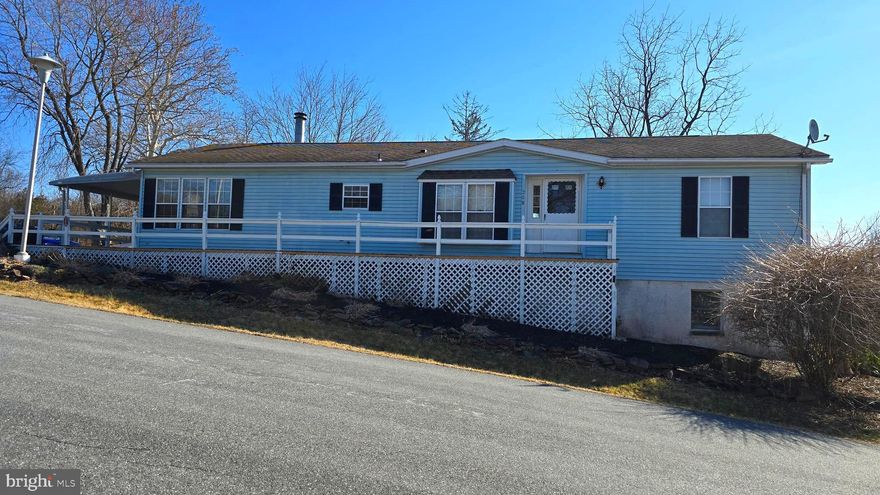 ** Situated on the outskirts of the community , this home offers three bedrooms and two full baths and sits on a full walkout basement for plenty of storage. Spacious rooms inside, a fireplace and a wraparound deck too.**
