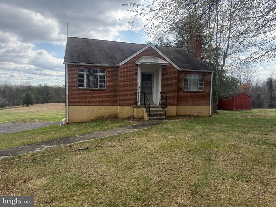 You will not want to miss this amazing opportunity in Warrenton on almost an acre. This home features 2 bedrooms, 1 full bathroom, kitchen and living room with wood burning insert in the fireplace. Walkout from main level into sunroom with stairs to yard. Lower-level walkout basement is unfinished. Furnace 5 years old. New water heater. New 200-amp electric panel. Septic just pumped. Large, cleared lot with outside fireplace and fire pit. Storage shed. Perfect for an investor or make the updates, add bedrooms, bath to lower level, and make it your forever home. Home needs cosmetic updates and is sold AS IS. NO HOA. Come fall in love.