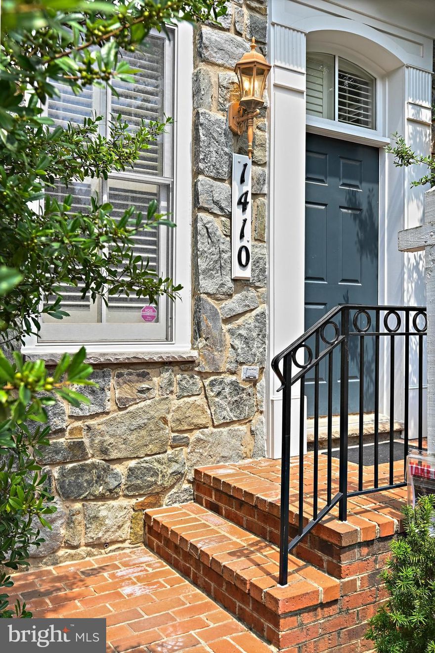 Stunning end-unit brick townhome located in the prestigious gated community of Evans Farm in the heart of McLean. This beautifully maintained residence offers four spacious levels, an elevator to three levels, and has been freshly painted throughout, making it move-in ready and full of natural light from three sides. The main level features elegant formal living and dining rooms, perfect for entertaining, and a large chef’s kitchen with stainless steel appliances, ample cabinetry, and an adjoining breakfast area. French doors lead to a charming private flagstone patio—ideal for dining and outdoor relaxation. The inviting family room with fireplace creates a warm and functional gathering space. The upper level showcases a luxurious primary suite with tray ceiling, spa-like en-suite bath with dual vanities, soaking tub, separate shower, and an expansive walk-in closet. Two additional bedrooms, a shared full bath, and an upper-level laundry room provide comfort and convenience. The top-level loft is perfect as a fourth bedroom, guest suite, office, or studio, complete with a walk-in closet, full bath, and access to attic storage. The fully finished lower level includes a spacious recreation room, game area, full bath, bonus room, and a library—offering versatile living and entertaining options. Situated in a secure, beautifully landscaped community with cobblestone streets and  paths, this home is ideally located just minutes to downtown McLean, Tysons, the Silver Line Metro, major commuter routes, and top-rated schools. A rare opportunity to enjoy elegant, low-maintenance living in a prime McLean location.