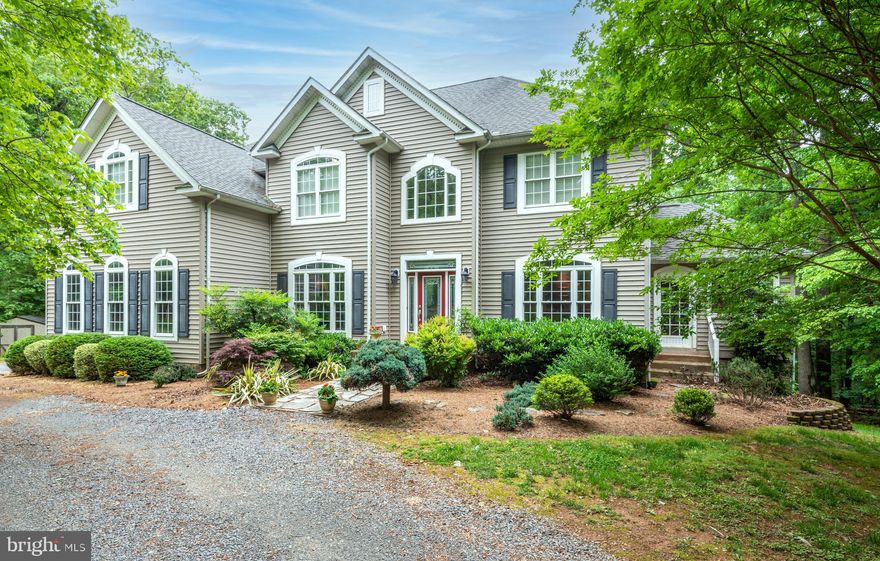 PRICE REDUCED..MOTIVATED SELLER!!!LOOKING FOR PEACE & QUIET? YOU WON'T WANT TO MISS THIS ELEGANT 4700+ SQ FT HOME ON 5+ ACRES IN MARSHALL. THIS LOVELY HOME BOASTS 4 BEDROOMS, 3.5 BATHS. STUNNING GOURMET KITCHEN WITH GRANITE COUNTERTOPS & BACKSPLASH, WOLF 6 BURNER PROPANE COOKTOP,  WOLF DOUBLE OVEN,  SUBZERO REFRIDGERATOR, LARGE CENTER ISLAND FEATURING A CENTER SINK, TWO (2) MIEHLE DISHWASHERS, WINE RACK , CHERRY CABINETS  WITH  BEAUTIFUL CUSTOM HANDLES & DRAWER PULLS, VIKING WINE REFRIDGERATOR, HARDWOOD FLOORS, SPACIOUS PANTRY & GE MICROWAVE, LARGE SUNROOM THAT WILL ACCOMODATE A KITCHEN TABLE FOR ALL OF THE FAMILY TO RELAX IN THE FAMILY ROOM OVERLOOKING THE POND AND BACK YARD. THIS ROOM HAS SOARING CATHEDRAL CEILINGS, PROPANE FIREPLACE WITH CARVED STONE MANTLE. THE LARGE DINING ROOM & LIVING ROOM COMBO OFF OF THE KITCHEN MAKES THIS HOME AN ENTERTAINERS DREAM. THE BEAUTIFULLY CRAFTED CROWN MOLDING AND SHADOWBOXING ARE A LOVELY ADDITION TO THESE ROOMS. CLIMB THE CURVED STAIRCASE TO THE 2ND LEVEL LIVING AREA. THE LARGE PRIMARY BEDROOM OFFERS A SITTING ROOM AS WELL AS A WALK IN CLOSET WITH BUILT IN SHELVING FOR ALL OF YOUR CLOTHING AND STORAGE NEEDS. PRIMARY BATH HAS A LARGE SOAKING TUB AS WELL AS A CUSTOM TILE SHOWER WITH A  FULL BODY SPA SHOWER HEAD.  THE GUEST BEDROOM ON THIS LEVEL HAS ITS OWN ACCESS TO THE HALL BATH AND THE OTHER TWO BEDROOMS HAVE A JACK & JILL BATH.  THERE IS A LAUNDRY ROOM WITH A STACKING WASHER DRYER ON THE UPPER LEVEL . THIS HOME ALSO FEATURES A RINNAI TANKLESS WATER HEATER TO ENSURE YOU WILL ALWAYS HAVE HOT WATER. NEWLY INSTALLED  CARRIER DUAL ZONE AIR CONDITIONING UNIT (2020)  IF YOU'RE LOOKING FOR THE FINER THINGS IN LIFE YOU WILL FIND THEM ALL HERE IN THIS LOVELY HOME. DON'T DELAY MAKE YOUR APPOINTMENT TODAY!