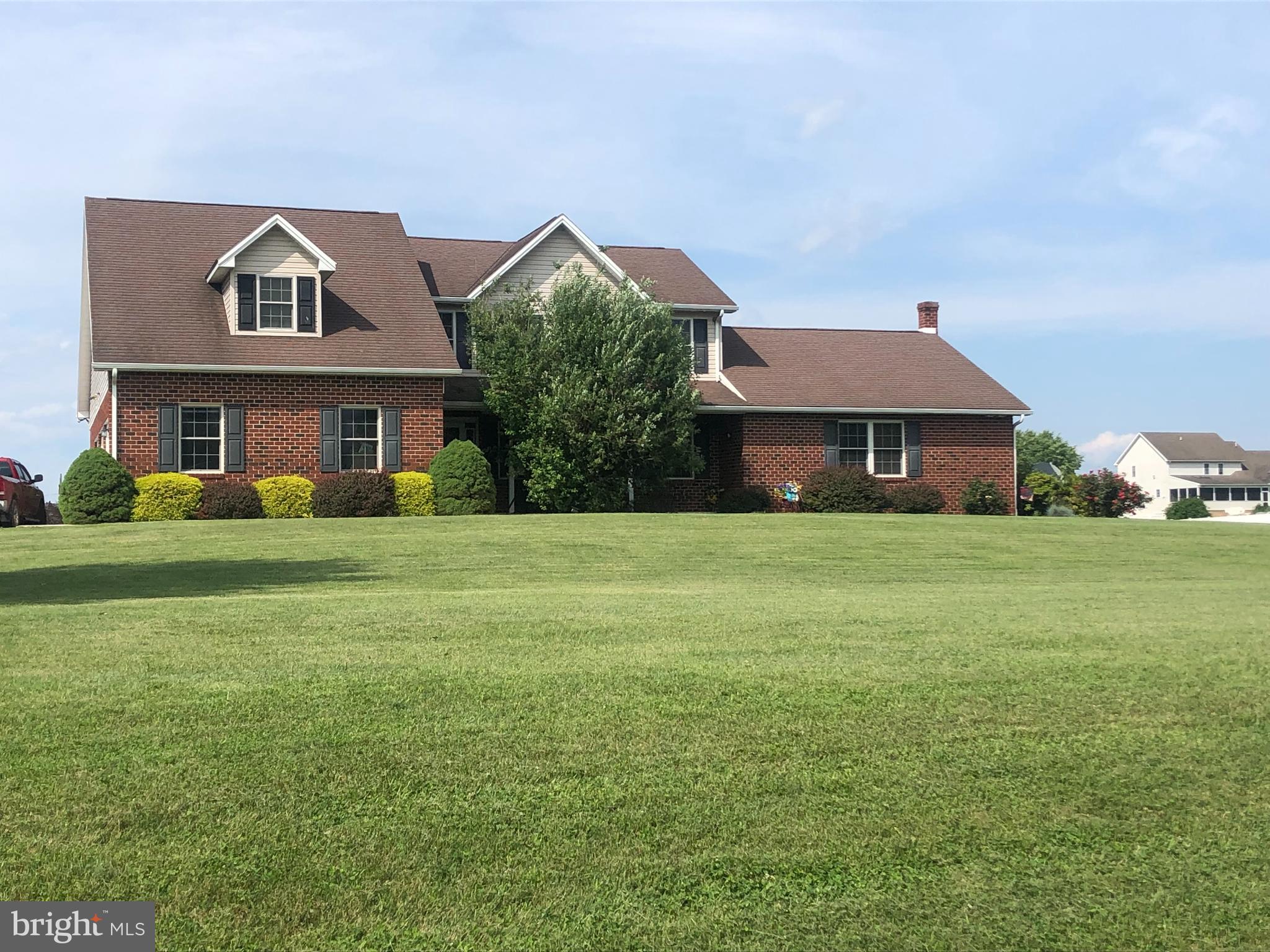 Welcome to this well-maintained, single-owner home nestled in the desirable Stonewall Ridge community. This spacious 4-bedroom, 3.5-bathroom colonial offers a rare and versatile layout featuring two primary suites—perfect for multi-generational living or accommodating overnight guests. One primary suite is conveniently located on the main level, just off the kitchen and living room, and features a walk-in closet, double vanity, soaking tub, and a walk-in shower with seat. The second primary suite is located upstairs and also includes its own walk-in closet and private bath. Situated on a generous 2.2-acre lot, the home provides plenty of room to spread out—inside and out. The welcoming covered front porch is a perfect spot to relax with guests, while the covered back porch offers ample space for outdoor entertaining.
Inside, you'll find two spacious living areas, giving you flexibility to host, relax, or create separate spaces for different needs. A cozy propane fireplace adds warmth and charm to the main living room. The eat-in kitchen features beautiful oak cabinetry and abundant storage, ideal for preparing meals and gathering with family and friends. Working from home? There’s plenty of room for one—or even two—home office spaces. The partially finished basement provides even more flexibility—whether you need a rec room, workout area, hobby space, or additional storage. A wood stove located in the unfinished section of the basement provides an efficient supplemental heat source during colder months. Outside, you'll find a well-equipped storage shed with electric, built-in shelving, and 220 AMP service—perfect for powering a pool, RV, or workshop setup. A three-car garage completes the package, offering space for vehicles, hobbies, or extra storage. Additional features include main-floor laundry, ceiling fans in every bedroom, a dog run, central vacuum system, and a water filtration system for the refrigerator. All of this in a peaceful country setting—just minutes from downtown Shippensburg and I-81. Come experience the comfort, space, and versatility this wonderful home has to offer! Call me today for a showing.