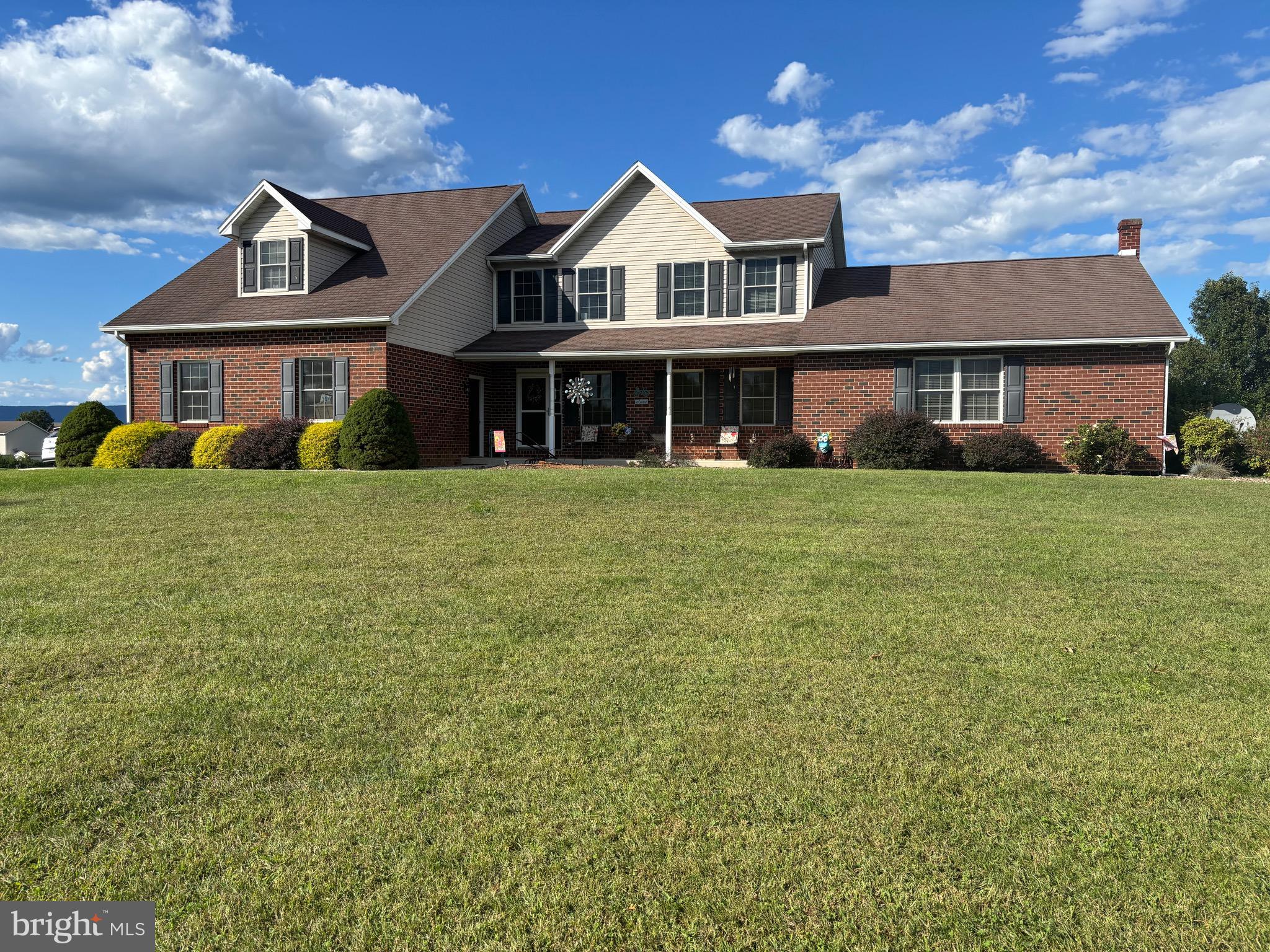 Welcome to this well-maintained, single-owner home nestled in the desirable Stonewall Ridge community. This spacious 4-bedroom, 3.5-bathroom colonial offers a rare and versatile layout featuring two primary suites—perfect for multi-generational living or accommodating overnight guests. One primary suite is conveniently located on the main level, just off the kitchen and living room, and features a walk-in closet, double vanity, soaking tub, and a walk-in shower with seat. The second primary suite is located upstairs and also includes its own walk-in closet and private bath. Situated on a generous 2.2-acre lot, the home provides plenty of room to spread out—inside and out. The welcoming covered front porch is a perfect spot to relax with guests, while the covered back porch offers ample space for outdoor entertaining.
Inside, you'll find two spacious living areas, giving you flexibility to host, relax, or create separate spaces for different needs. A cozy propane fireplace adds warmth and charm to the main living room. The eat-in kitchen features beautiful oak cabinetry and abundant storage, ideal for preparing meals and gathering with family and friends. Working from home? There’s plenty of room for one—or even two—home office spaces. The partially finished basement provides even more flexibility—whether you need a rec room, workout area, hobby space, or additional storage. A wood stove located in the unfinished section of the basement provides an efficient supplemental heat source during colder months. Outside, you'll find a well-equipped storage shed with electric, built-in shelving, and 220 AMP service—perfect for powering a pool, RV, or workshop setup. A three-car garage completes the package, offering space for vehicles, hobbies, or extra storage. Additional features include main-floor laundry, ceiling fans in every bedroom, a dog run, central vacuum system, and a water filtration system for the refrigerator. All of this in a peaceful country setting—just minutes from downtown Shippensburg and I-81. Come experience the comfort, space, and versatility this wonderful home has to offer! Call me today for a showing.