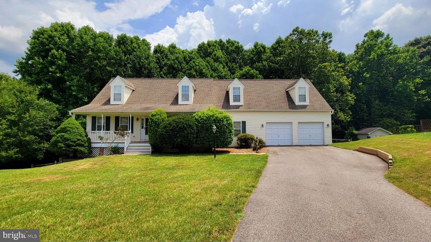 The seclusion and privacy you want with the close proximity of everything you need!  Situated on just over 3/4 an acre, this one owner home boasts 4 bedrooms, 3 of them with walk in closets.  One bedroom on the main floor next to 1 of 3 full baths.  Dual staircases lead to the 2nd floor with a loft area perfect for a reading nook or office.  The kitchen has some updates and expansive counter space and cabinets including a breakfast bar.  The kitchen also attaches to a dining space and overlooks the step down family room with doors to the upper deck.  Formal living room on the other end of the house for your quiet space.  Downstairs is the unfinished basement ready for you to make your own.  Doors lead to 2nd deck and fenced backyard with gate to the remainder of the  wooded property.  Ample parking with paved driveway off the culdesac and 2 car garage.  Quick drive to shopping, dining and work commute.    New HVAC just installed and flooring allowance will be considered with right offer.
Price of home reflects the need for some cosmetic updates.