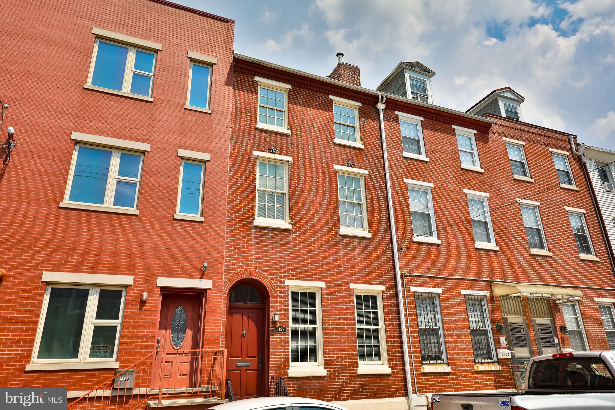 Welcome to this stunning and spacious 6-bedroom, 3-bathroom brick townhome at 1127 Green St, nestled in the heart of Philadelphia's vibrant and historic Spring Garden neighborhood. One standout feature of this property is its former multi-family zoning that was licensed by the city and lapsed in 2020, providing potential for future expansion or conversion. There is a studio apartment located on the fourth floor. This remarkable property boasts over 2,600 square feet of living space spread over five levels, providing ample room for all your lifestyle needs. Meticulously cared for and maintained, this home welcomes you with a warm and inviting living area as you step into the foyer. Beautiful hardwood floors, crown molding, brick fireplace and large windows fill the space with natural light. The main level offers a full bedroom with a large closet and a full bathroom, ideal for use as an in-law suite, home office, or additional living space. There is also convenient access to the private parking spot, located just steps from the back entrance of the home. The beautiful staircase leads to the second floor featuring a generous sized bedroom with sitting area, ample closet space and a full bathroom with tub. The third floor is devoted to two additional bedrooms with closets. The fourth floor currently is a studio apartment including a kitchen and full bathroom with walk in shower. The fifth floor has two additional bedrooms that are connected by a door. The basement, recently waterproofed and equipped with a sump pump, is very clean, offers ample storage space, and could easily be finished for additional space. The large basement could easily be converted to a fitness room, theater area, game room or office space. Situated in the 19123 zip code, this home is just a short distance from a wide variety of shops, restaurants, cafes, and nightlife. You'll also find easy access to public transportation, parks, and cultural landmarks, making it an ideal location for both convenience and lifestyle. This home offers the perfect blend of luxury and convenience in one of Philadelphia's most sought-after neighborhoods. Don't miss this incredible opportunity to own a piece of Philadelphia's history and make it your own!