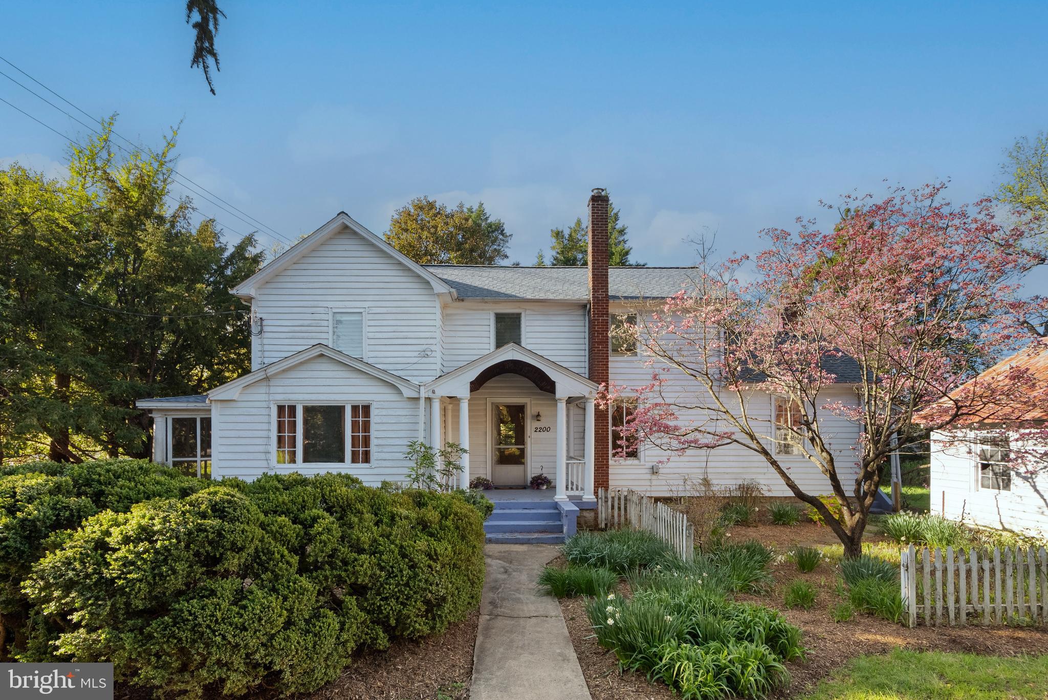 This home has a soul and the land tells its story. Built nearly a century ago as a wedding present, 2200 Enterprise Road has only had a few families call it home. Set on a wide, usable corner lot with a massive detached workshop, this is the kind of property that rarely comes up, and never lasts.
The Waesche family lived here for over 50 years. They even dug the cellar (see photo) by hand with a horse and plow so they could keep canned goods cool. The dining room shelving was crafted from the windows of their first car—a Model A Ford. Even the oak floors were sourced during WWII, when such materials were hard to come by.
The current family, who owned a landscaping business, spent decades cultivating the grounds with the wide variety of flowers and trees you see today. They even ran a popular seasonal wreath business from the property. The soil here is exceptional, and the setting is peaceful and private, yet highly accessible.
The home today is well-built and full of charm. All major systems are functional, the roof is brand new, and while some cosmetic updates would go a long way, it’s ready for its next chapter. A wraparound driveway makes for easy access, and the detached workshop out back is a rare find—perfect for contractors, hobbyists, or anyone needing serious space.