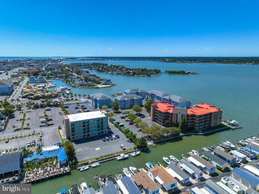 Bayside living at its best! This fully furnished efficiency-style one bedroom beach house is steps from the Ocean City Boardwalk, beaches, dinning, and nightlife. Inside you'll love the updated kitchen and bath, new flooring, and private balcony overlooking the canal. Outside, take advantage of the boat launch, boat tie-up area, outdoor shower, picnic and grill space, plus elevator and laundry convenience. Just bring your flipflops - everything else is ready for you!