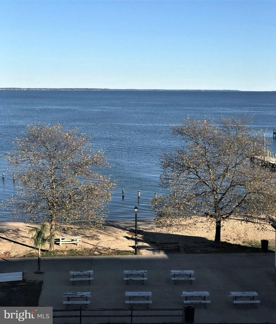 Beautiful Condo with panoramic views of the Potomac River. Fabulous location in the town of Colonial Beach. Top floor, corner unit, hardwood floors, granite countertops, stainless appliances, one covered parking space, large owner's suite with river views and in home laundry room. Colonial Beach is a golf cart community that includes public beaches, public boat ramp, boardwalk, marinas, fabulous restaurants, tiki bars and breweries. Colonial Beach is known as "The Playground on the Potomac."  Walk, hike or ride your bike. An easy ride to explore the wineries of the Northern Neck as well. One and 1/2 hours from DC and Richmond and 45 minutes from Fredericksburg. Come on over! Put your toes in the sand!