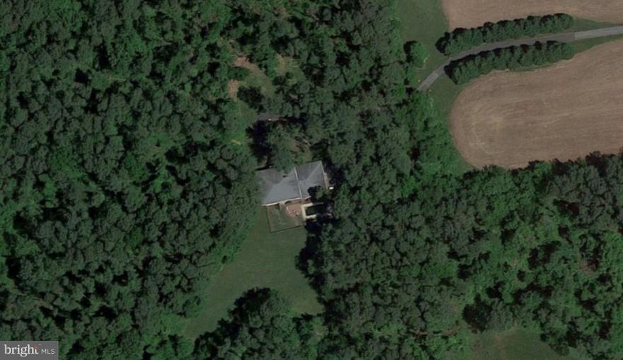 Large, brick Colonial home with 3-car garage, in-ground pool and two-story passive solar sunroom on 5 acres of private and secluded land with mature trees.  For Comp Purposes Only.