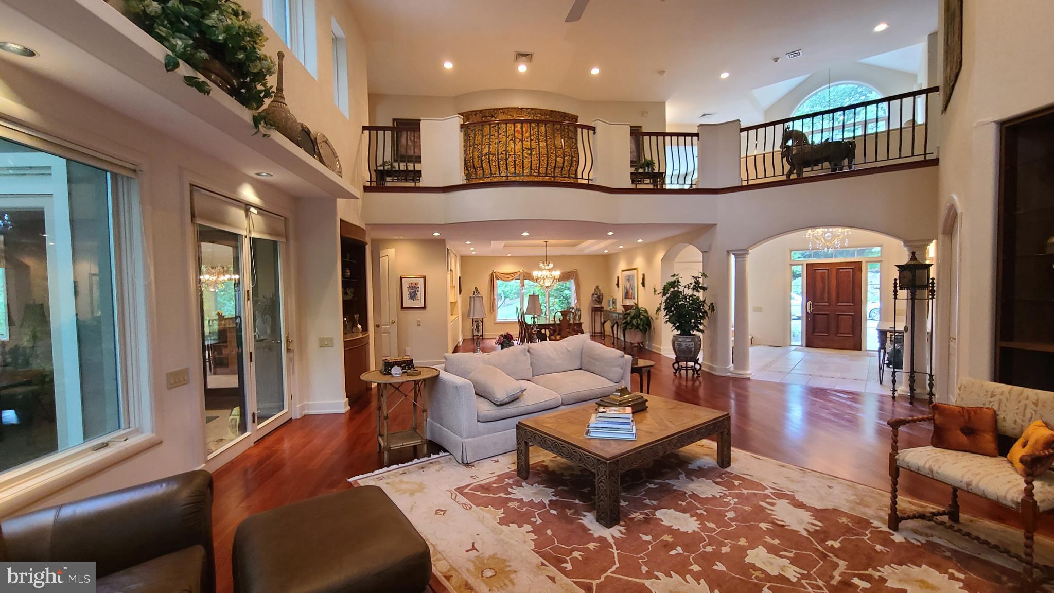 Privacy awaits you with this incredible custom built estate home on a quiet, private cut-de-sac street with only 5 homes. Drive up the long drive, and then the winding driveway to this premier home, in the exclusive Meadowbrook section. You will never lose power with the House Generator. Almost 3 private acres of extended landscaping and pavers. Magnificent built-ins throughout. The foyer has travertine tile flooring, and leads into a dramatic open floorplan, with a 2 story great room with a fireplace, and a full wall of windows, facing the incredible backyard and resort style infinity pool, with a hot tub and waterfall. The gourmet kitchen is huge, full of cabinets, and open, and has a Sub-Zero refrigerator, 48inch Viking Range, and Granite countertops, as well as a pantry. There is a Florida room right off the kitchen, surrounded by glass, facing the pool as well. There is a nicely sized powder room, and entrance into the oversized 3 car attached garage. The formal dining room has a dual tray ceiling, and built in cabinets. There is an office/bedroom on the first floor, with a full bath, that can be used by your outside guests, so no one will have to walk through the house when accessing from the pool. The upper level has a huge Owners suite, with access to a large private balcony, and his/hers closets, and a spa like bathroom, with a barrel-vaulted ceiling, two vanities, and an oversized open shower for two. there is a jetted spa tub, and toilet room with a bidet. There is a cat walk overlooking the great room. The second bedroom is extra large, and has its own private balcony. The 3rd bedroom is nicely sized, and has a walk-in closet. (there is a way to add an additional bedroom if needed, without sacrificing much from the other bedrooms, at a minimal cost). There is a hall bath with a whirlpool tub and a stall shower. Convenient 2nd floor laundry room, with access to its own balcony. The lower level is walk-out, and there is a full bathroom as well, great bar/kitchen seating area, billiard room, as well as an incredible Theater with 2 rows of seats. 3 zone Radiant heated floors, central vacuum system, fenced yard, and rounded corners throughout most of the home. Located a couple minutes from the Meadowbrook train station, for easy commutes to the city. Natural Gas Barbecue for you pool parties. This is a "must see" one of a kind estate custom home for the distinguished buyer!!