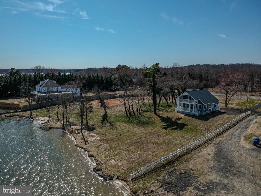 Own One of the Largest Waterfront Lots in Benedict w/ Unobstructed Views of the Patuxent River: 4 Bedroom/3 Bath 2-Story Waterfront Situated on 1.79 Acres +/- in Quaint Waterfront Community of Benedict in Charles County.  Downstairs Offers an Open Floor Plan Concept in the Front of the House with Water Views in Every Direction and Two (2) Bedrooms Facing Mill Creek Road. Upstairs You Will Find an Oversized Bedroom with French Doors Leading to a Second Floor Porch Overlooking the River as well as One Full Bathroom and an Additional Bedroom/Office/Sitting Room. Entertain or Relax Enjoying the Picturesque Views of the Patuxent River from the 1st or 2nd Floor Porches Off the Front of the House or the Expansive Yard that Leads to a Sandy Beach.  Potential to Subdivide Lot in the Future, if Public Sewer Comes to Benedict.