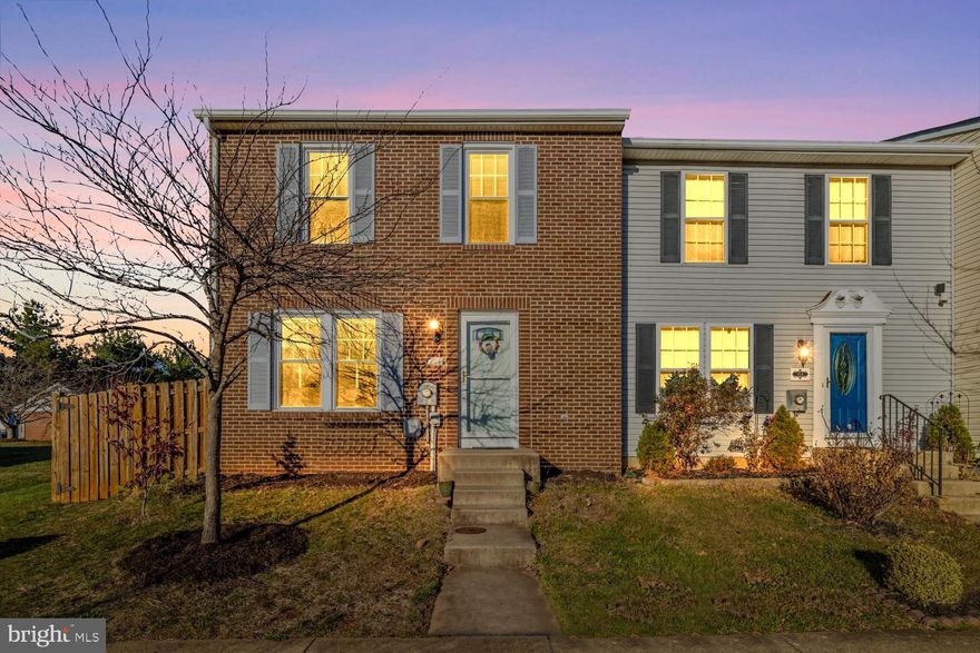 Welcome to 215 Stull Court in Thurmont, Maryland! This charming brick-front end-unit townhome offers a warm and inviting layout with thoughtful updates and plenty of natural light. Step inside to a sunny living room with window seat and wood floors, creating the perfect space for everyday comfort or entertaining. The kitchen offers updated LVP flooring, a stylish ceramic tile backsplash, a large pantry and ample cabinetry. Just off the dining area is a convenient main-level laundry area, making daily chores a breeze.The spacious dining area sits adjacent to the kitchen and provides easy access to the backyard perfect for outdoor dining and relaxing. Upstairs, you’ll find a generous primary bedroom with rich wood floors, a private en-suite bath, and abundant closet space. Two additional bedrooms and a well-appointed hall bath complete the upper level. The finished lower level offers a cozy family room with a fireplace, ideal for movie nights or evenings at home. A separate storage/utility room provides plenty of extra space for organization. Outside, the large fenced backyard features a patio, offering a private area for enjoying morning coffee or gathering with friends. This end-unit townhome includes two assigned parking spaces right out front for maximum convenience. Major mechanical updates include a new HVAC system installed in 2021 and a water heater installed in 2024, giving peace of mind for years to come.