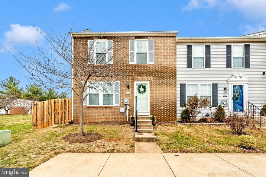Welcome to 215 Stull Court in Thurmont, Maryland! This charming brick-front end-unit townhome offers a warm and inviting layout with thoughtful updates and plenty of natural light. Step inside to a sunny living room with window seat and wood floors, creating the perfect space for everyday comfort or entertaining. The kitchen offers updated LVP flooring, a stylish ceramic tile backsplash, a large pantry and ample cabinetry. Just off the dining area is a convenient main-level laundry area, making daily chores a breeze.The spacious dining area sits adjacent to the kitchen and provides easy access to the backyard perfect for outdoor dining and relaxing. Upstairs, you’ll find a generous primary bedroom with rich wood floors, a private en-suite bath, and abundant closet space. Two additional bedrooms and a well-appointed hall bath complete the upper level. The finished lower level offers a cozy family room with a fireplace, ideal for movie nights or evenings at home. A separate storage/utility room provides plenty of extra space for organization. Outside, the large fenced backyard features a patio, offering a private area for enjoying morning coffee or gathering with friends. This end-unit townhome includes two assigned parking spaces right out front for maximum convenience. Major mechanical updates include a new HVAC system installed in 2021 and a water heater installed in 2024, giving peace of mind for years to come.