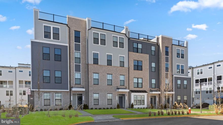 *OFFERING UP TO 15K IN CLOSING ASSISTANCE WITH USE OF PREFERRED LENDER AND TITLE.* New Construction, luxury 2-level condo located in the Kincora community in Dulles, Virginia is available for January move-in.  Enter the Clarendon from either the main front entrance or the private entrance through the rear garage. Both entry points lead to the main living level which opens to the dining room and an adjacent powder room. This END UNIT home has an abundance of light with windows on 3 sides of the home, 9-foot ceilings throughout & LVP flooring throughout the main level. The center kitchen showcases an open design with KitchenAid Stainless Steel Appliances and an oversized 12' island. Continue to the rear of the main level, where the great room seamlessly connects to an outside covered lanai with an outdoor gas fireplace. The primary suite includes an enormous walk-in closet and an ensuite bath equipped with a dual sink vanity, a walk-in shower with a seat, and a private water closet. Additionally, there are two generously sized secondary bedrooms, a full bath with a dual sink vanity, and a conveniently placed laundry room on the upper level with a wash basin. *Photos may not be of actual home. Photos may be of similar home/floorplan if home is under construction or if this is a base price listing.