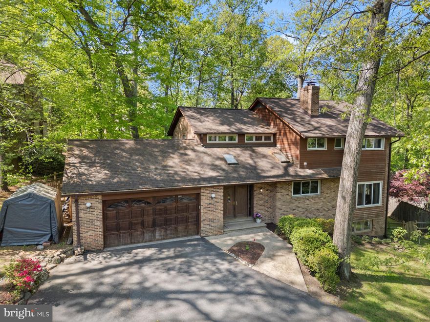 ***Still accepting back-up offers.  Showing times available, please send a request***. 
Modern, bright, and surrounded by nature — this beautifully updated 4-bedroom, 4-bath home in the quiet, established Congressional Forest neighborhood offers the kind of space, style, and location that’s hard to find. Inside, the open layout is flooded with natural light from replacement windows, skylights, and multiple sliding doors that bring the outdoors in. The heart of the home is the sleek European-style kitchen, with quartz countertops, updated appliances, soft-close cabinets, and a large island that makes cooking, entertaining, and everyday living effortless. Step down into the cozy living room with a custom fireplace wall and built-ins, or head out to the expansive deck that overlooks a fully fenced backyard with synthetic turf and your very own private sport court. Whether you’re hosting friends or enjoying a quiet evening at home, the space feels both private and peaceful. Upstairs, you’ll find three spacious bedrooms, each with its own remodeled en suite bathroom — a rare and thoughtful touch. The primary suite feels like a true retreat, with treetop views, a spa-like bath featuring heated floors, a steam shower, freestanding tub, and double floating vanities. Downstairs, the walk-out basement includes a fourth bedroom, another full bath, and a ton of storage. The rest of the space is a blank canvas—ready for your dream home gym, playroom, media space, or guest suite. There’s even more to love: Two-zone HVAC for year-round comfort, EV charging outlet in the garage, central vacuum system, dedicated laundry/mudroom with sink and storage, hardwood floors, updated lighting, and high-end finishes throughout. The location is just as impressive: You’re minutes from Glen Echo Park, Cabin John Village, the C&O Canal, and downtown Bethesda. It’s a commuter’s dream with easy access to Clara Barton Parkway and I-495. Zoned for top-rated Montgomery County Public Schools: Seven Locks Elementary, Cabin John Middle, and Winston Churchill High. You’re also close to some of the area’s most prestigious private schools. If you’ve been looking for a home that checks all the boxes—style, function, location, and soul—9220 Beech Hill Dr might just be it.