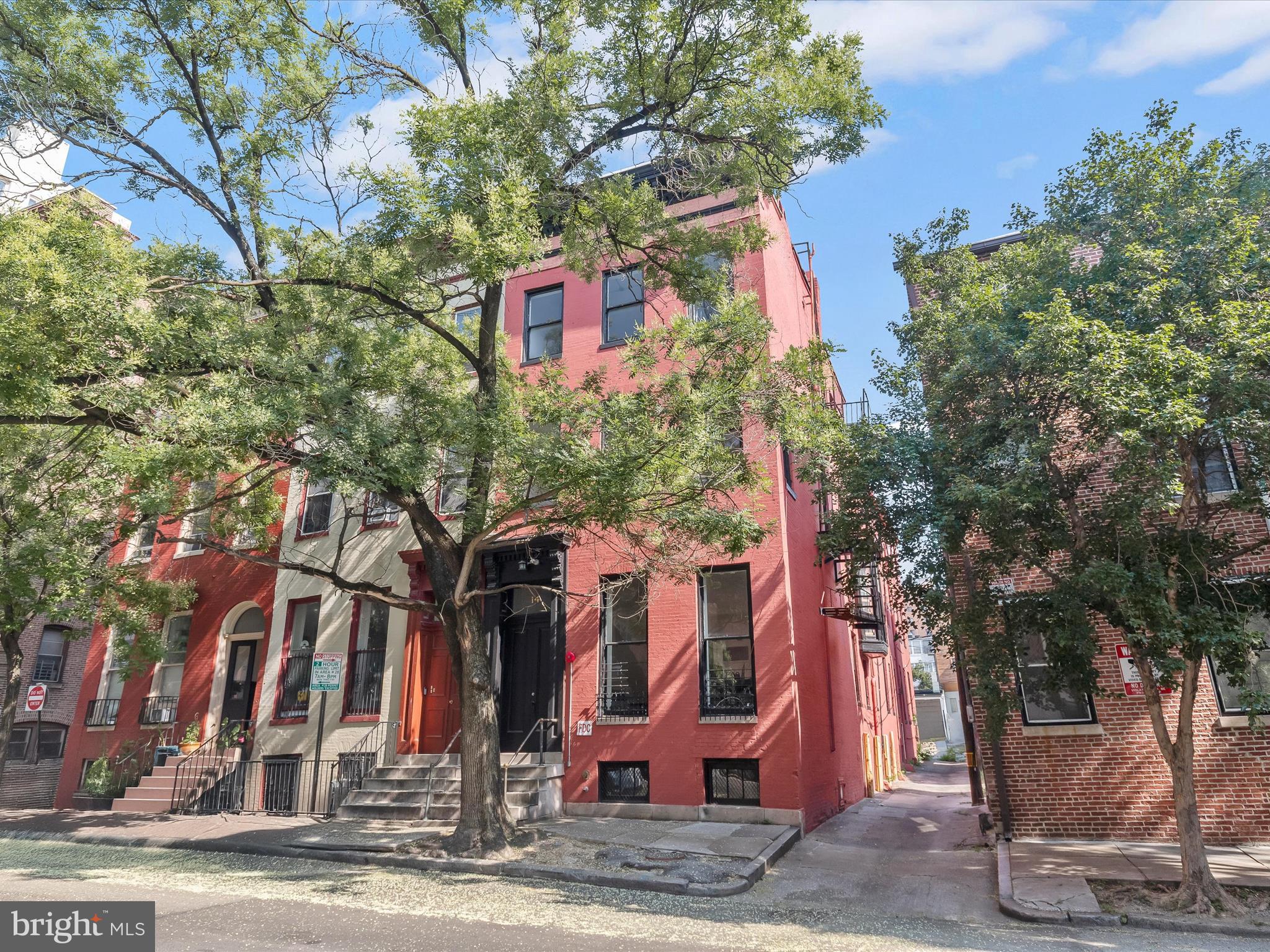 Introducing this exceptional opportunity to own a fully renovated six-unit property in the heart of Baltimore’s vibrant Mount Vernon neighborhood. This four level building includes one 1-bedroom/1.5-bath unit, three 1-bedroom/1-bath units, and two 2-bedroom/2-bath units that were upgraded in 2023 with modern finishes, hardwood and LVP floors, decorative fireplaces, tall ceilings, and abundant natural light that enhance tenant appeal. A private parking space in the rear adds convenience. Each unit features a stylish kitchen with quartz countertops, 42-inch shaker-style cabinets, and stainless steel appliances. Bathrooms include contemporary tile finishes with walk-in or tub-showers. The main level offers two units - Unit 1 has (1 bedroom/1.5 baths) while Unit 2 has (1 bed/1 bath). The second level includes Unit 3 (1 bed/1 bath) and Unit 4 (2 beds/2 baths). On the top floor, Unit 5 offers (1 bed/1 bath), while Unit 6 includes (2 beds/2 baths). All units are equipped with their own electric meters, along with new HVAC systems, water heaters, and in-unit laundry. Ideal for investors seeking strong rental income or for an owner-occupant looking to live in one unit while renting out the others. Prime location close to the Walters Art Museum, Mount Vernon Place, the Peabody Institute, Baltimore Symphony Orchestra, and a wide variety of dining, shopping, and entertainment options. Easy access to I-83, Metro stations, and public transportation. Some images have been virtually staged.