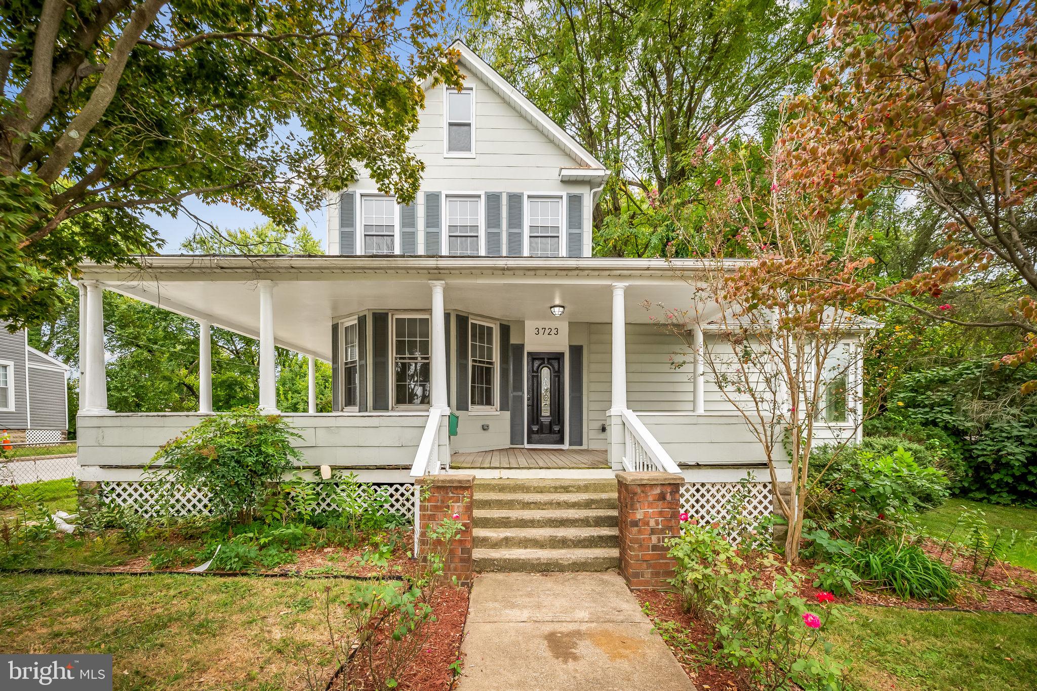 Welcome to this charming 5 bedroom, 3.5 bath home with a large wrap around covered porch. Brand new LVP flooring installed throughout the 1st and 2nd levels. Updated kitchen with breakfast bar, dining area, large living room with wood burning fireplace and 1/2 bath, main level bedroom with full bath and door to covered porch, 2nd level consists of the primary bedroom with full bath and walk in closet, bedroom 3 and hallway full bath, laundry closet on this level for convenience, 3rd level/finished attic has 2 bedrooms and there is also an unfinished basement should you need additional space for storage. This home is very spacious inside and out. The exterior of the property has a detached 2 car garage with a small parking pad, large yard surrounded by mature trees so you can enjoy your privacy while relaxing or entertaining. Convenient to shopping, dining and commuter routes.