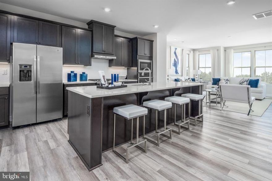 *** ASK ABOUT OUT IN FLEX CASH INCENTIVE *** JANUARY DELIVERY!         WELCOME TO WELLINGTON FARMS!
The Serenade plan offers an updated take on outdoor living, with a covered deck included off the main level. This Serenade features model like finishes!!!  Inside, the kitchen has a large island, plenty of cabinets and a pantry for storage, and the option to do a double wall oven. Upstairs are 3 large bedrooms, including the owner's suite with walk-in closet and bath with dual vanities and large shower with a seat. On the lower level is a 4th bedroom and full bath, plus a 2-car garage.