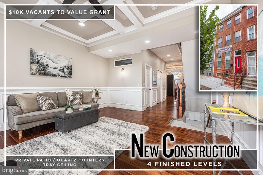 EXTRAORDINARY HOLLINS MARKET RENOVATION 4 FINISHED LEVELS OF LIVING SPACE! Open floor plan featuring a spacious living room with coffered ceiling & wainscoting, gourmet Chef's kitchen with Quartz counters, & ss appliances, a main level half bath, 2nd level with 2 bedrooms, 1 full bath, and desirable bedroom level laundry, a 3rd level Primary suite with vaulted ceiling, walk-in closet and a spa bath with double sinks & a walk-in shower, a finished basement with a family room, 4th bedroom, and 3rd full bath, zoned heating and air, and a large private patio! Property is eligible for 10k Vacants to Value grant! Conveniently located close to downtown Baltimore, UMMC, stadiums, and major roadways!  Call listing agent about $10K in closing assistance available!
