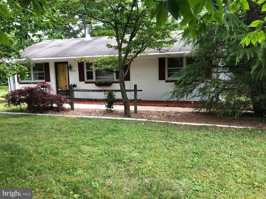 72 Hour Home Sale. Bids are being accepted. Call Now!"Location Location Location" Within 8 minutes to Metro, new shopping complex, Andrews Air force  Base and the beltway. Seller is retiring and has decided to depart with this amazing  rambler that nestles on close to a one acre lot. The exterior features a gigantic back yard, loaded with trees and space for gardening.  In addition to having  numerous evergreen and oak trees,  enjoy your peach tree and grapevine right out back.  Also, don't forget the  Japanese maple in the front yard.   The 2-car garage has been converted into a work area.  There is also an over-sized 6-car garage large enough to run a small factory.This property is perfect for the person looking for an intimate single-level home.  The interior has been maintained very well. There is hardwood flooring,  upgraded tile in the kitchen and a decorator wood burning stove.   The seller wants this property sold quickly so that he can get reestablished in his new residence. Don't miss this one!!!