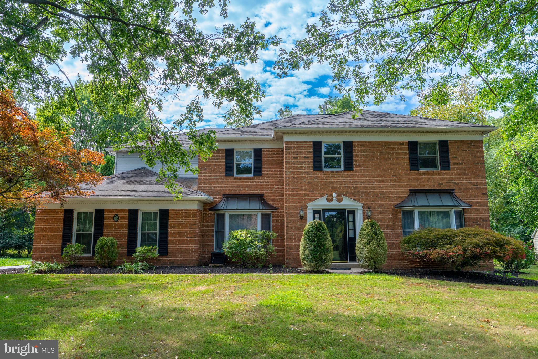 Welcome to 636 Eagle Ln. in desirable Brian Glen —an inviting 4-bedroom, 2.5-bath home sitting on a private, half-acre lot with mature trees in a wonderfully walkable neighborhood. A dramatic 2-story Foyer with hardwood flooring sets the tone, opening to a large, light-filled Living Room and an elegant formal Dining Room enhanced by gorgeous wainscoting, crown molding, and newer ceiling fixture. The eat-in Kitchen features stainless steel appliances, gas cooking, ample pantry, generous counter space, and an adjoining Breakfast Nook. Just off the Kitchen, the generously sized Family Room boasts a brick fireplace and wet bar—perfect for everyday living and effortless entertaining. Upstairs, all-new carpeting runs throughout the second floor. The huge Primary Bedroom Suite impresses with a separate vaulted-ceiling Sitting Room with skylight, walk-in closet, and spacious Primary Bath with soaking tub. Three additional big Bedrooms—all with ceiling fans and excellent closet space—share a beautifully renovated hall Bath showcasing a gorgeous dual vanity and new shower insert. Need more space? The finished Basement provides flexible room options and abundant storage. Additional highlights include generous room sizes throughout, a private paver patio out back, and a tranquil setting with room to relax, play, and garden.
Location checks every box: just minutes to Merck, downtown Lansdale and the Lansdale turnpike entrance, major routes 73, 63, 363 and 202, with nearby train/mass transit for easy commuting. This spacious home is just waiting for your own personal touches. Make sure to come take a look before it's gone!